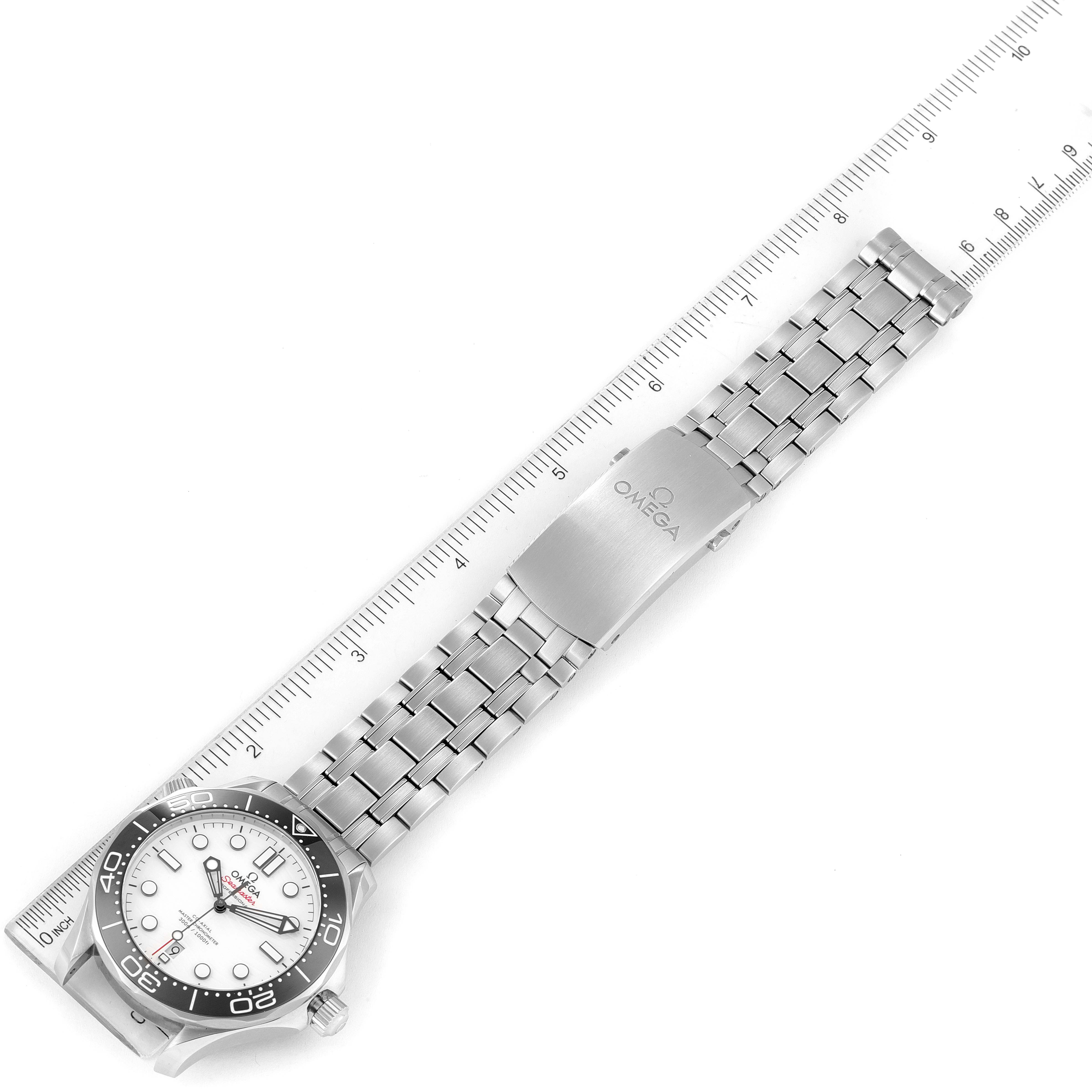 The image shows an Omega Seamaster 210.30.42.20.04.001 Men's Stainless Steel White Dial 210.30.42.20.04.001 Men's Stainless Steel White Dial watch laid flat, emphasizing the dial and bracelet, with a ruler for scale.