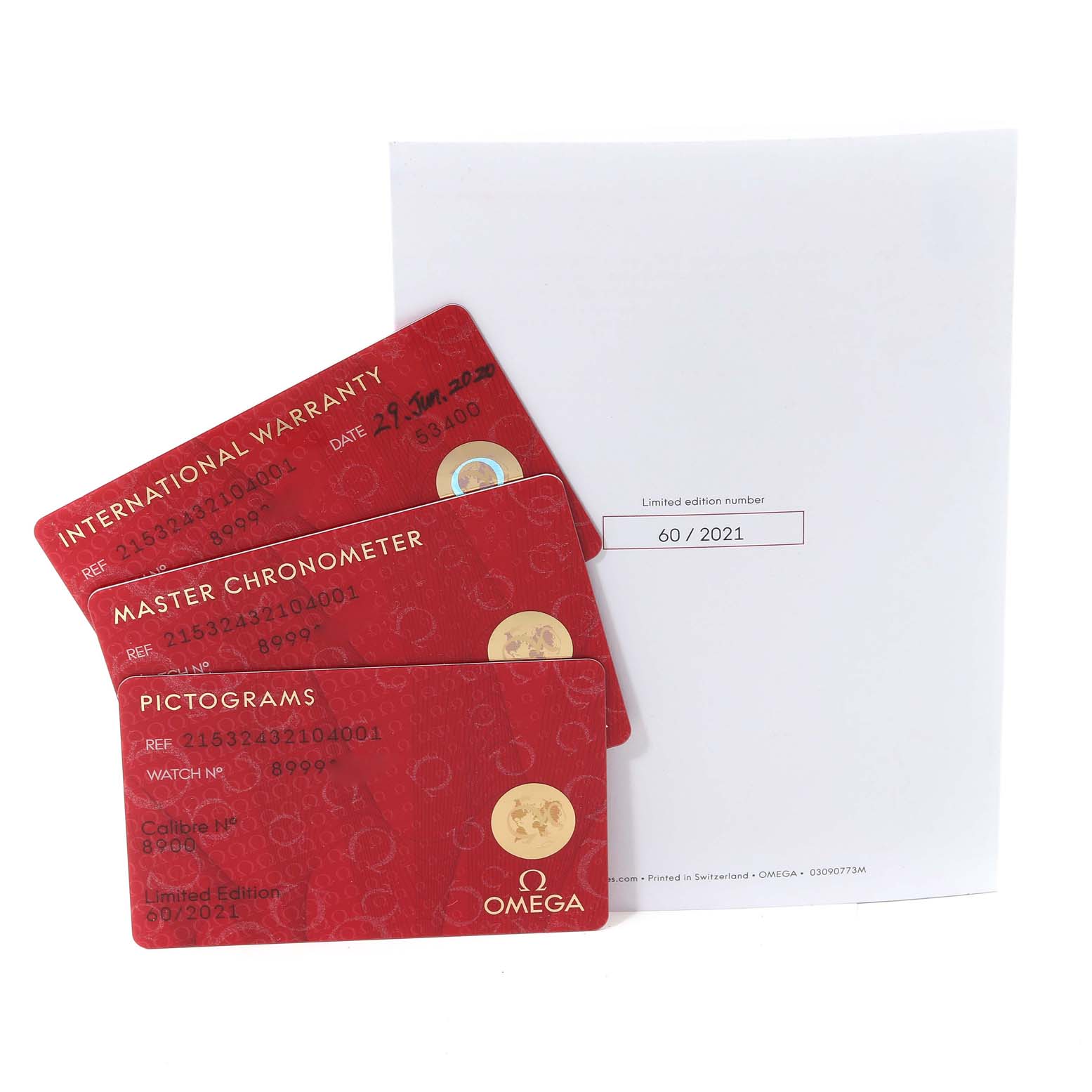 The image shows three red cards (International Warranty, Master Chronometer, Pictograms) and a white certificate for an Omega Planet Ocean 215.32.43.21.04.001 Men's Stainless Steel White Dial 215.32.43.21.04.001 Men's Stainless Steel White Dial watch.