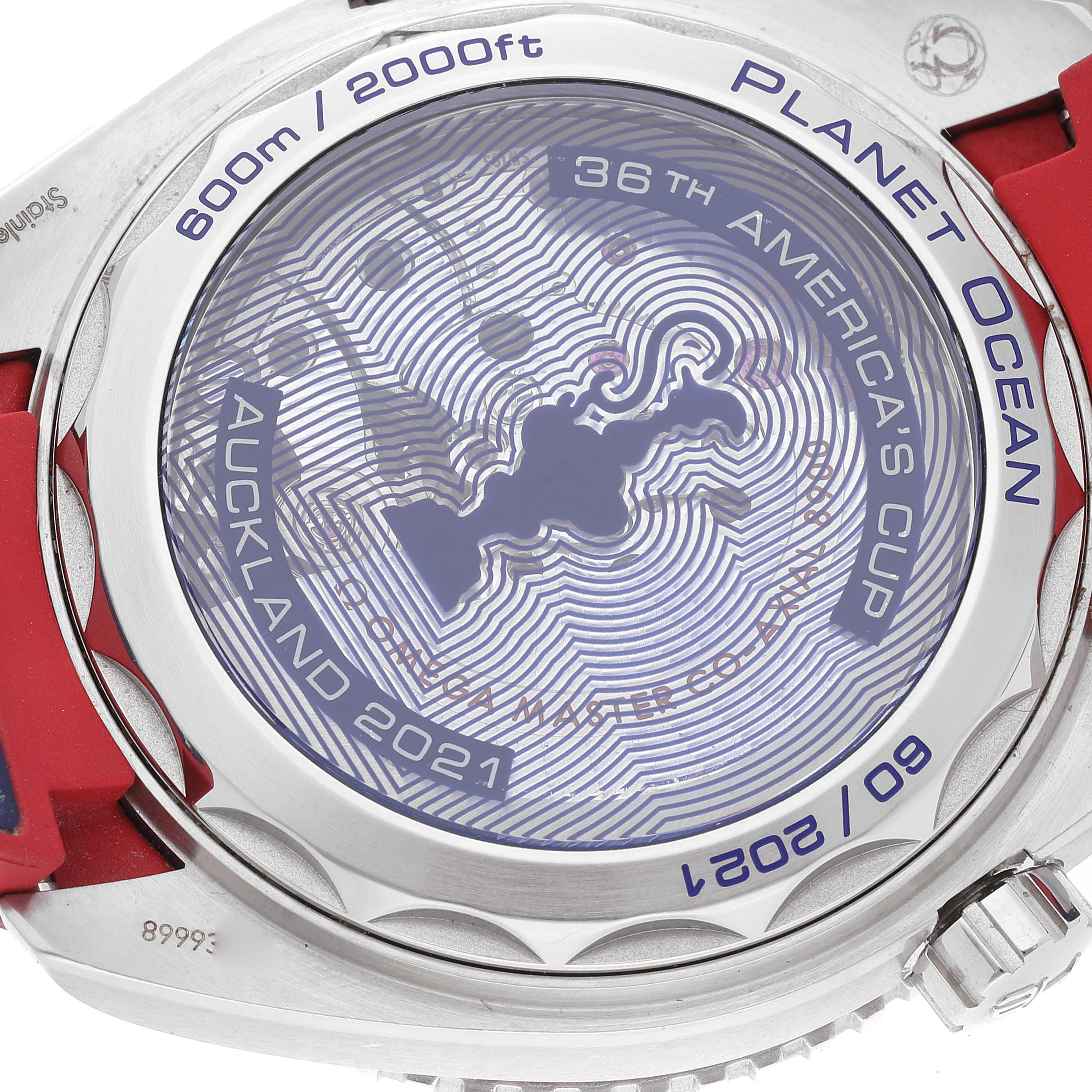 The image shows the case back of the Omega Planet Ocean 215.32.43.21.04.001 Men's Stainless Steel White Dial 215.32.43.21.04.001 Men's Stainless Steel White Dial watch, featuring engravings related to the 36th America's Cup.