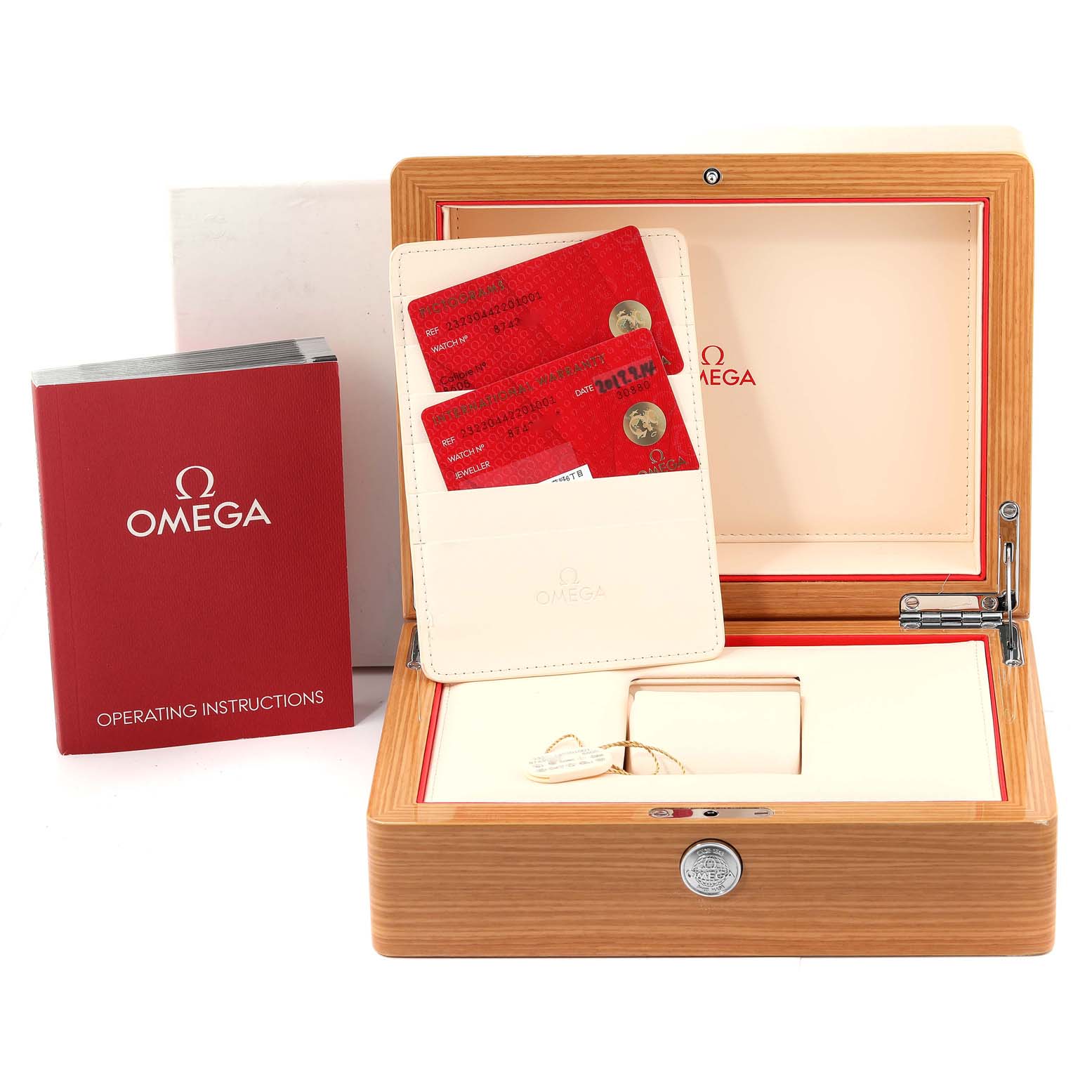 The image shows the Omega Planet Ocean 232.30.44.22.01.001 Men
s Stainless Steel Black Dial 232.30.44.22.01.001 Men
s Stainless Steel Black Dial watch box, warranty cards, and operating instructions from a front angle.