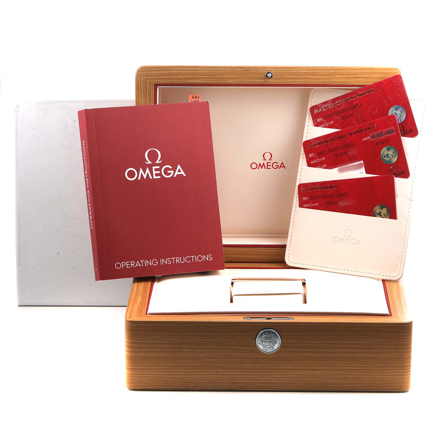 The image shows an Omega Speedmaster 332.12.41.51.10.001 Men's Stainless Steel Green Dial box set with operating instructions and cards, photographed from the front.