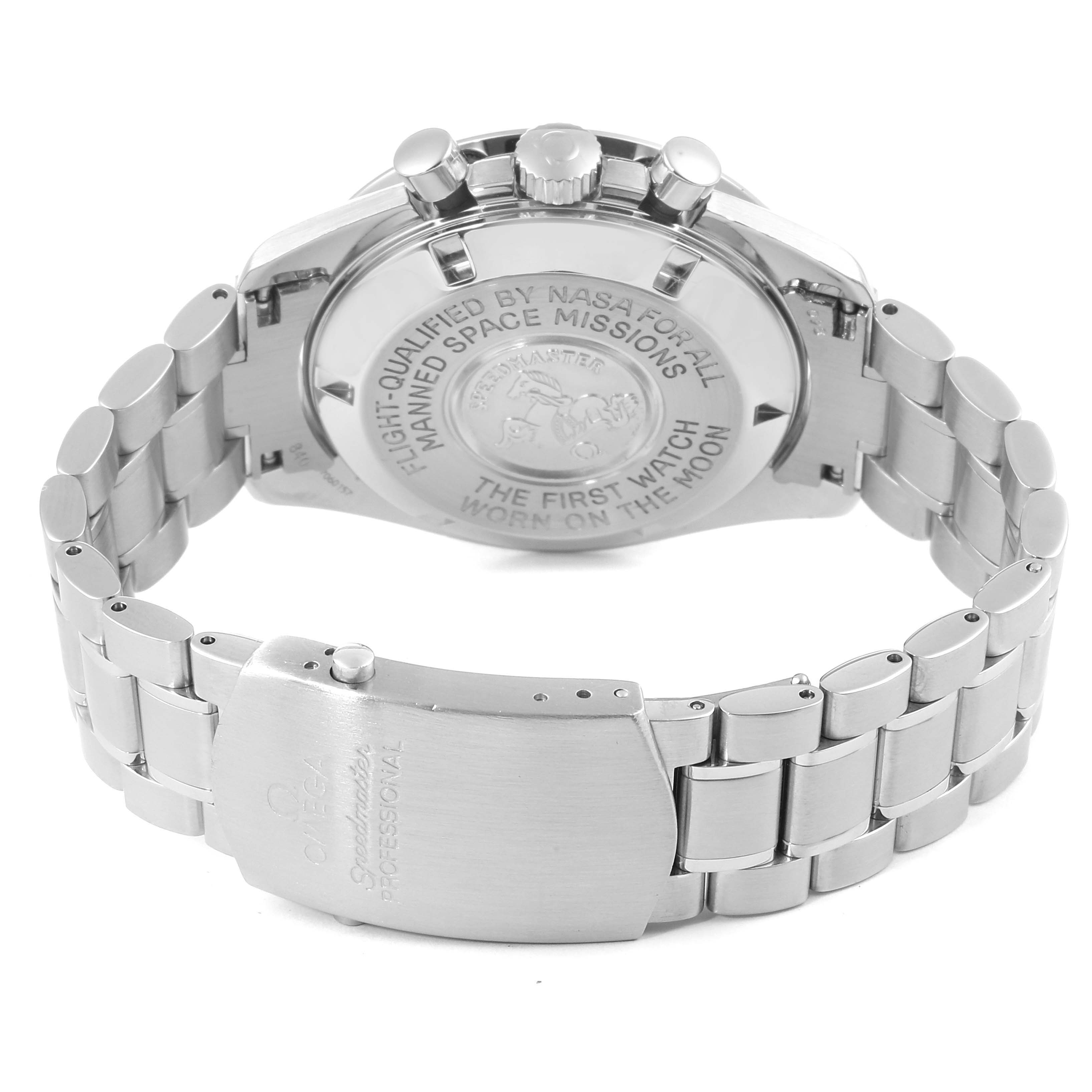 The image shows the back case and bracelet clasp of an Omega Speedmaster 3570.50.00 Men's Stainless Steel Black Dial 3570.50.00 Men's Stainless Steel Black Dial watch, engraved with its iconic moon-related inscriptions.