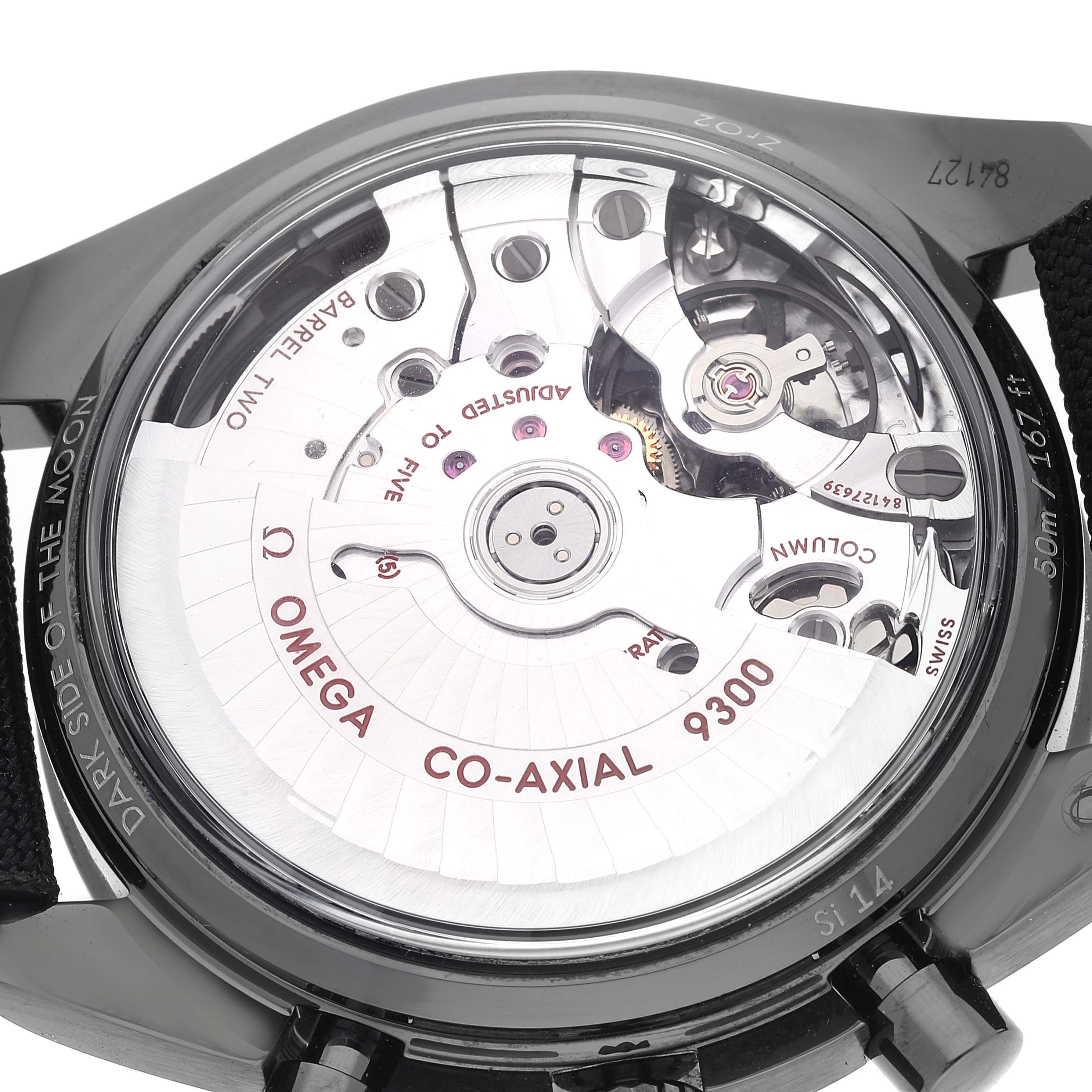 This image shows the back view of an Omega Speedmaster 311.92.44.51.01.005 Men's Stainless Steel Black Dial 311.92.44.51.01.005 Men's Stainless Steel Black Dial watch, showcasing its co-axial 9300 movement mechanism.