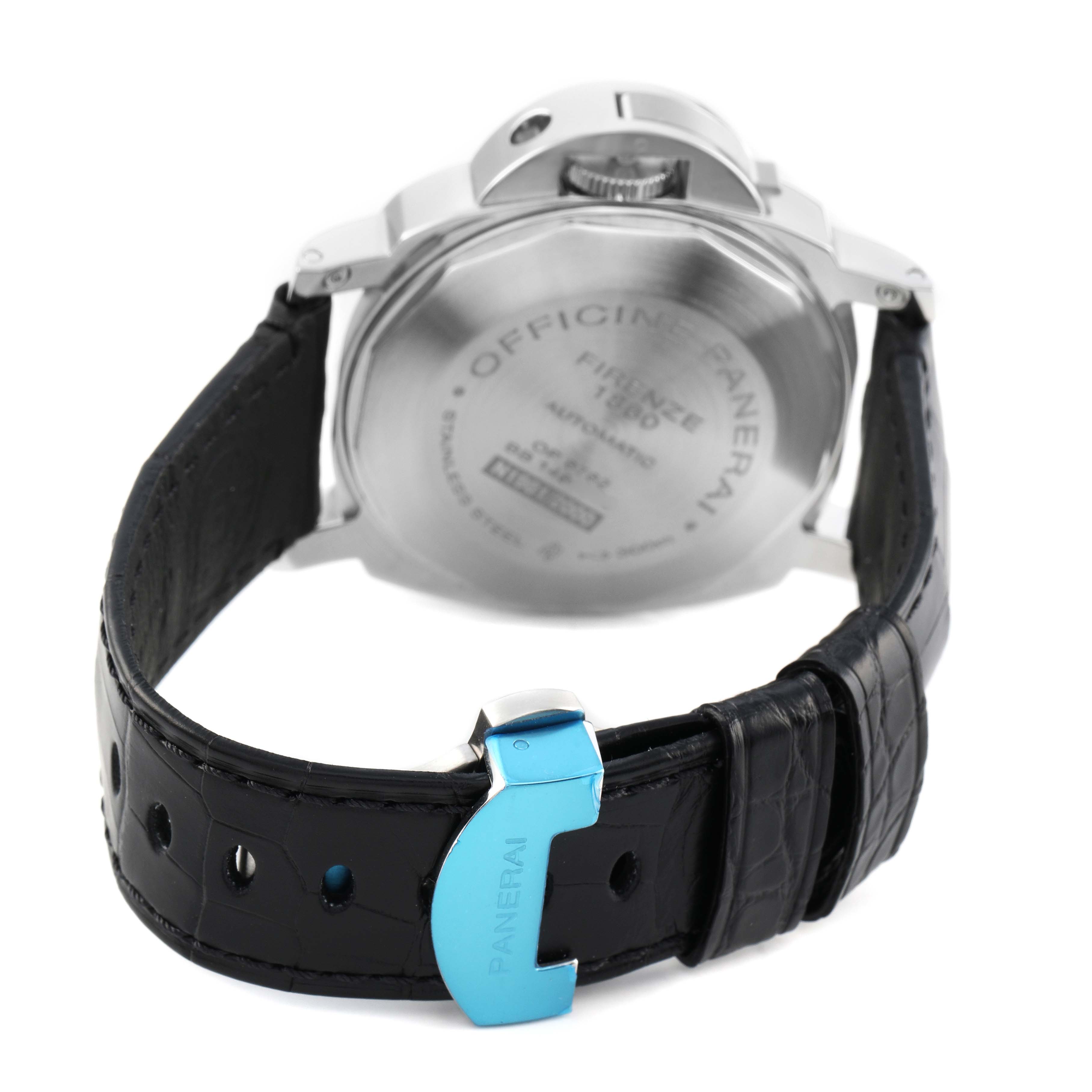 The image shows the back of a Panerai Luminor PAM00090 Men's Stainless Steel Black Dial watch, highlighting the case back, crown guard, and leather strap with a clasp.