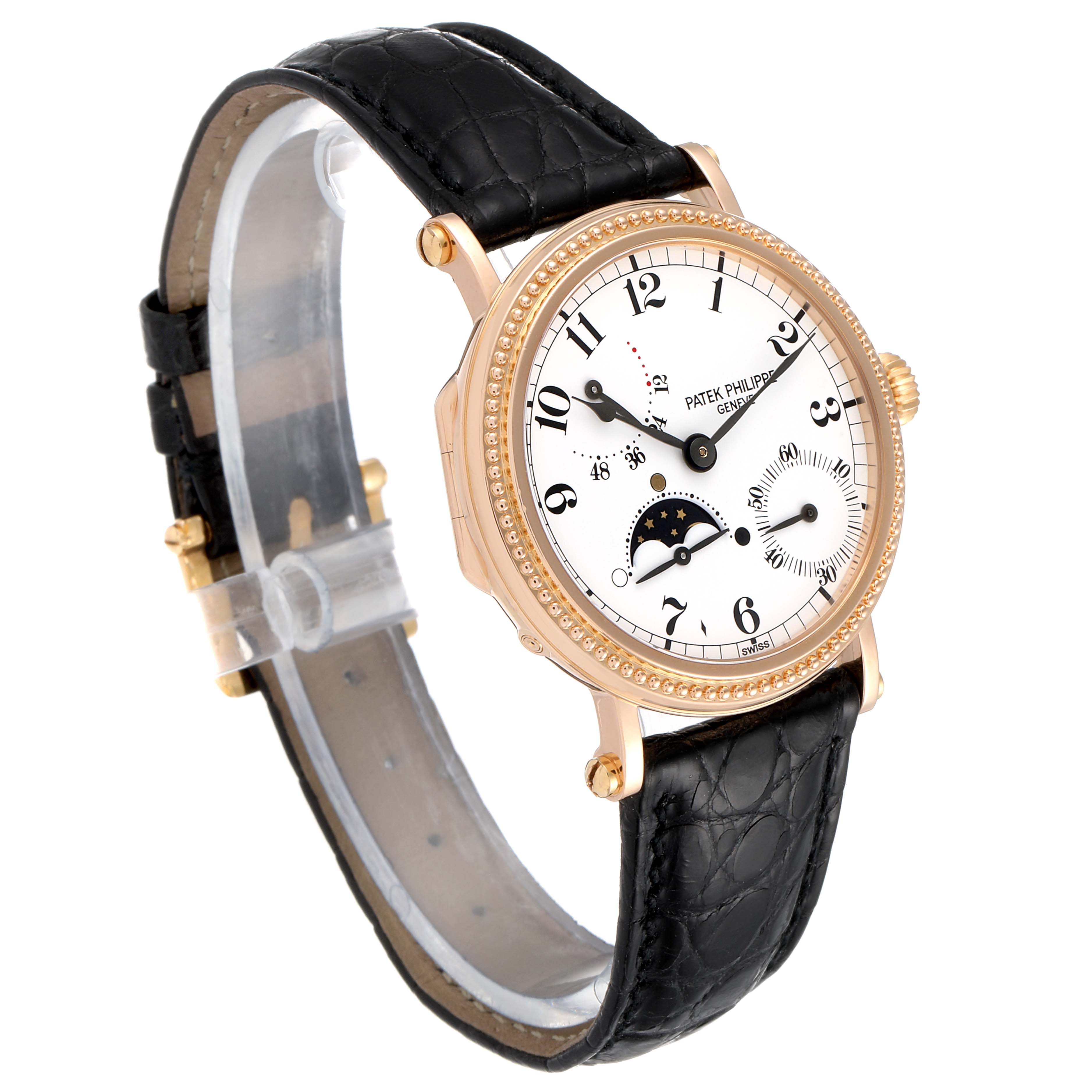 The image shows a Patek Philippe Calatrava 5015 Men's Rose Gold White Dial 5015 Men's Rose Gold White Dial watch at an angled side view, highlighting the dial, bezel, crown, and black leather strap.