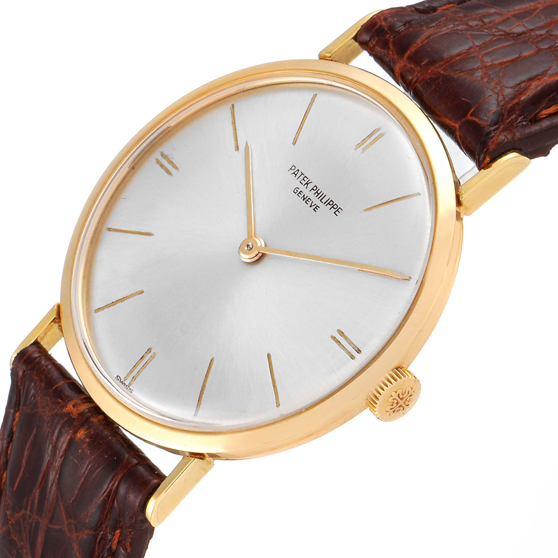 This Patek Philippe Vintage watch is angled to show the dial, crown, and leather strap.