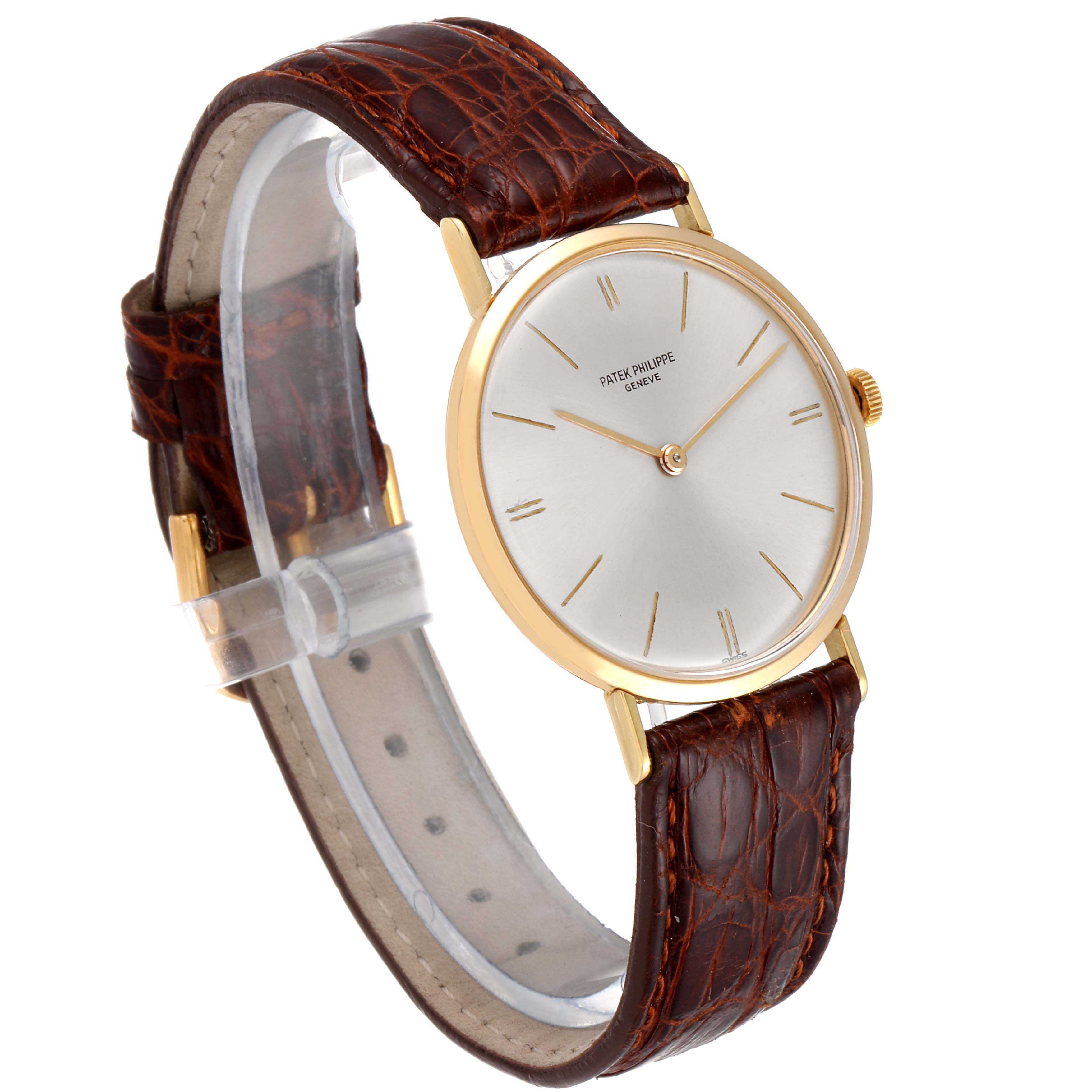 The image shows a side angle of the Vintage Patek Philippe watch, highlighting its brown leather strap and gold-colored case.