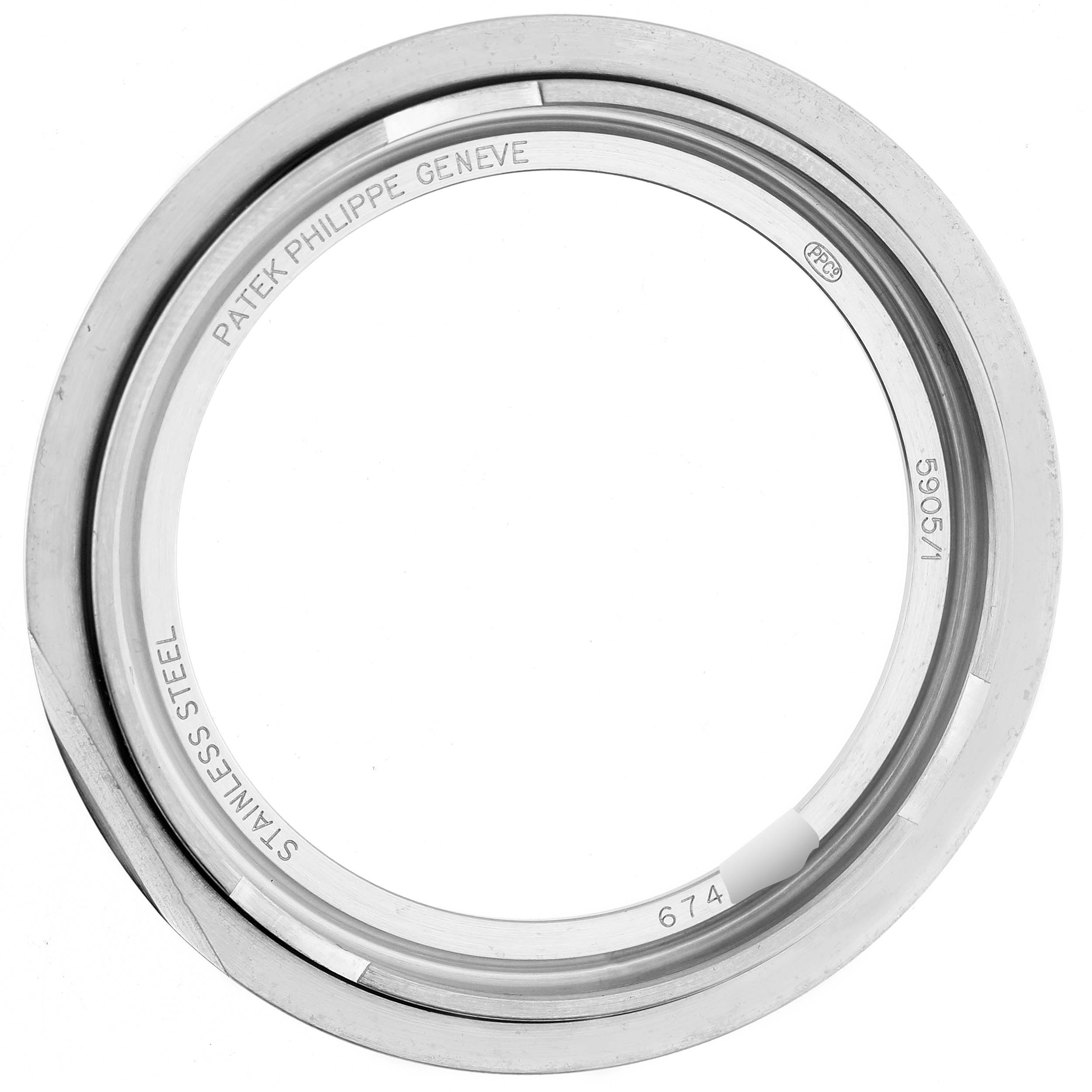 The image shows the stainless steel bezel of a Patek Philippe Complications 5905/1A-001 Men's Stainless Steel Green Dial model, viewed from above.