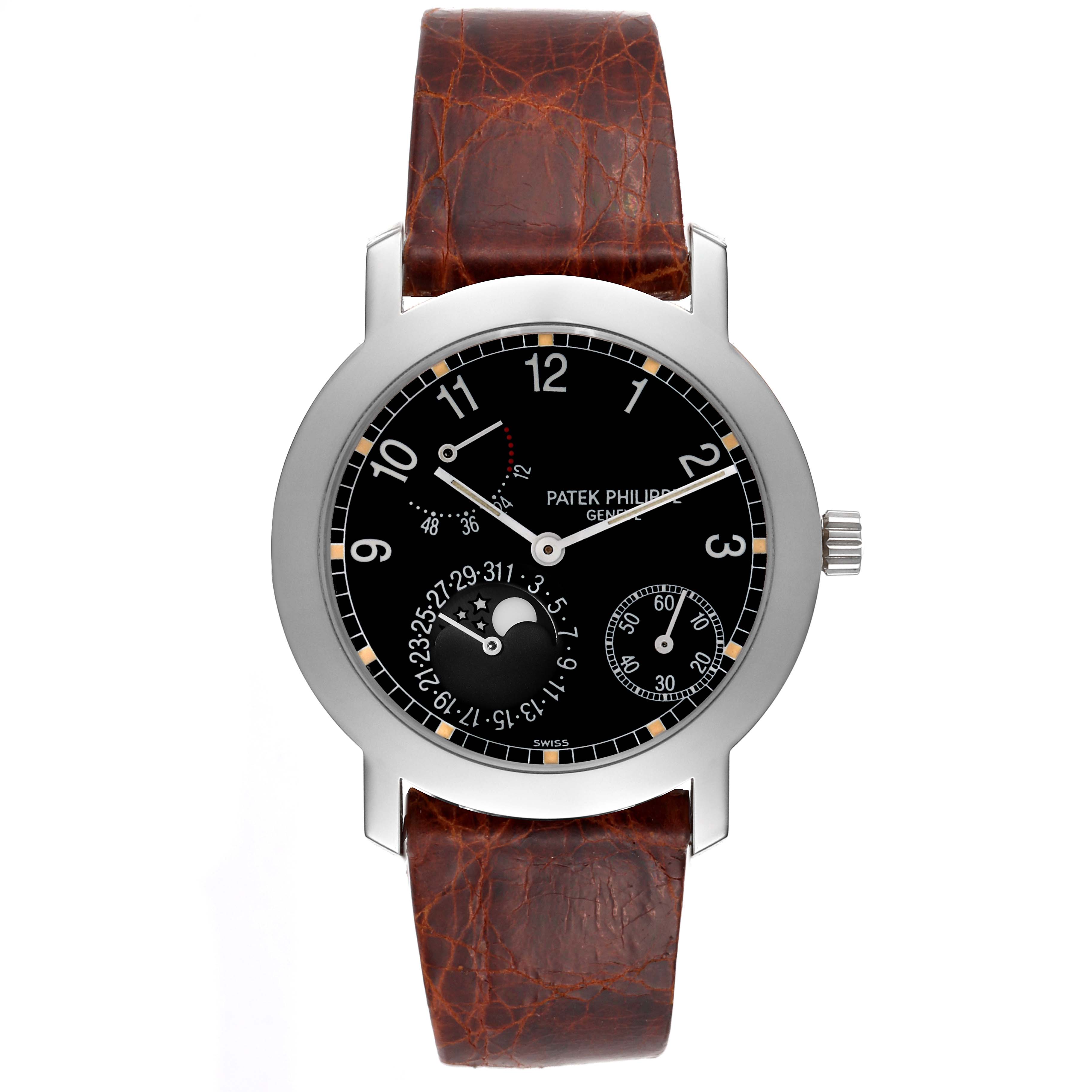 The Patek Philippe Complications 5055G-001 Men's White Gold Black Dial model is shown from a front angle, highlighting the dial, subdials, and leather strap.