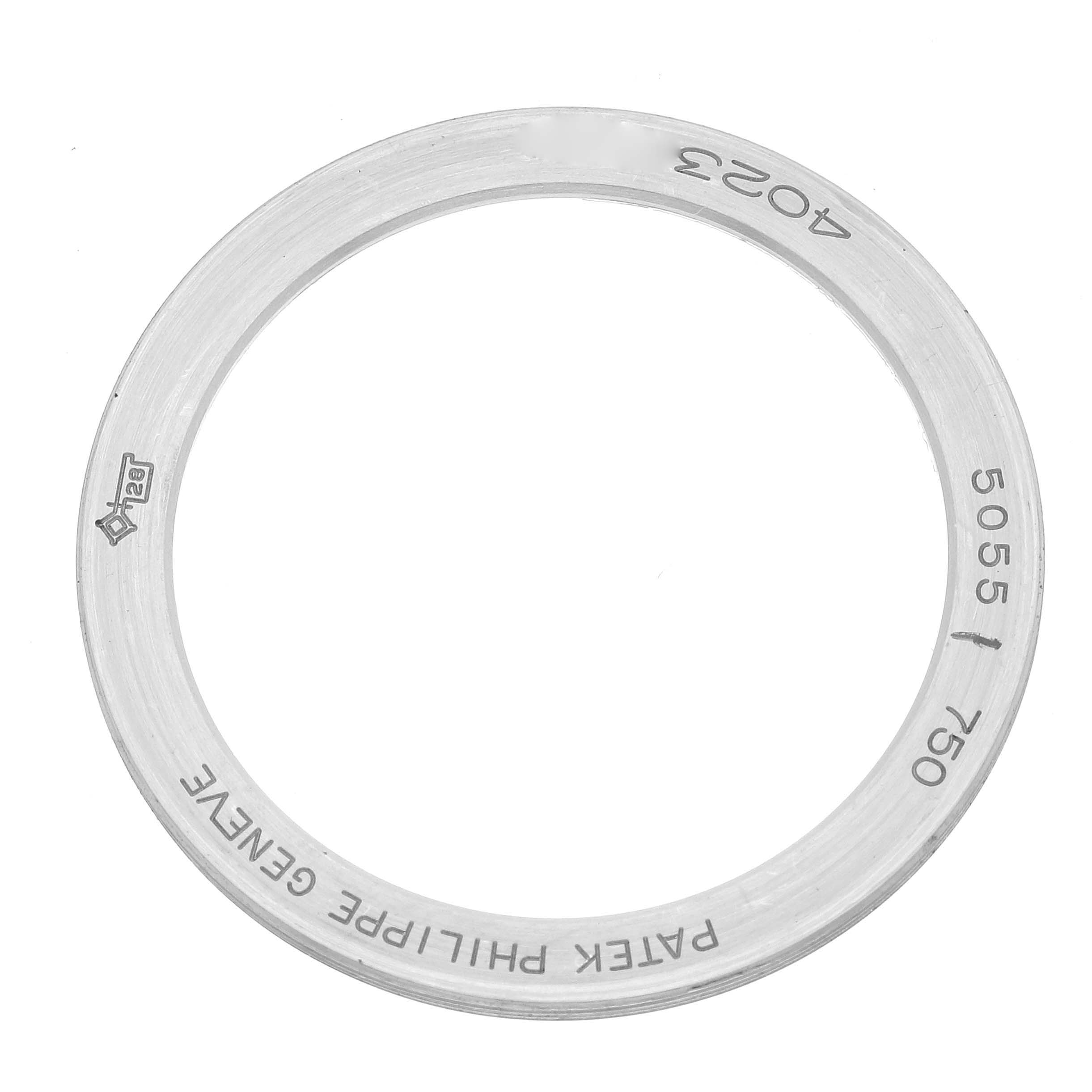 The image shows a metal bezel or ring for a Patek Philippe Complications 5055G-001 Men's White Gold Black Dial watch, viewed from above.