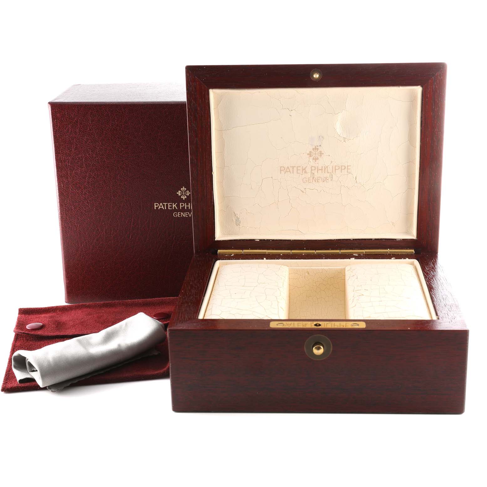 The image shows a Patek Philippe Complications 5110R-001 Men's Rose Gold Silver Dial 5110R-001 Men's Rose Gold Silver Dial watch box with the inner cushion, outer box, and a polishing cloth.