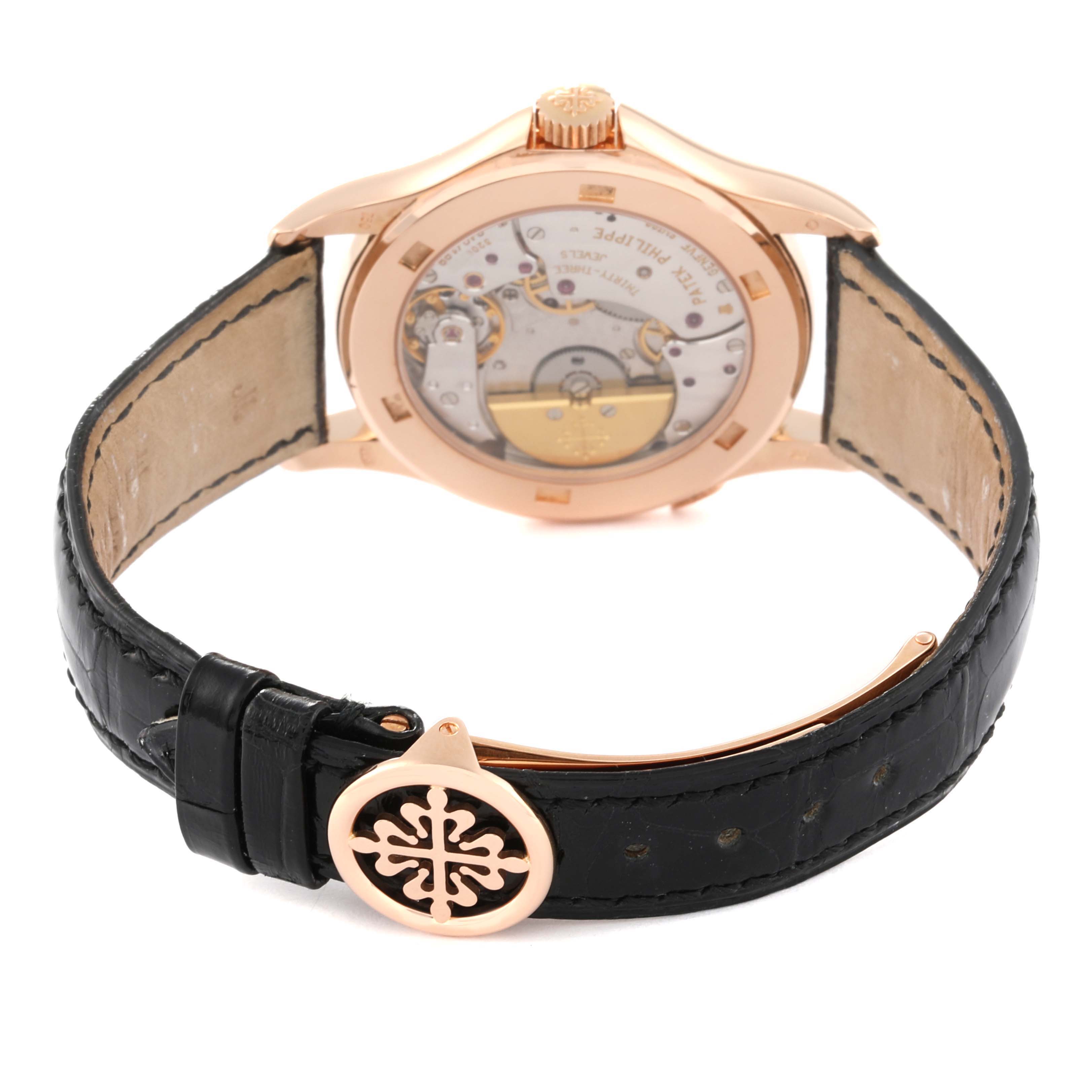 This image shows the back angle of a Patek Philippe Complications 5110R-001 Men's Rose Gold Silver Dial 5110R-001 Men's Rose Gold Silver Dial watch, highlighting its movement and leather strap with clasp.