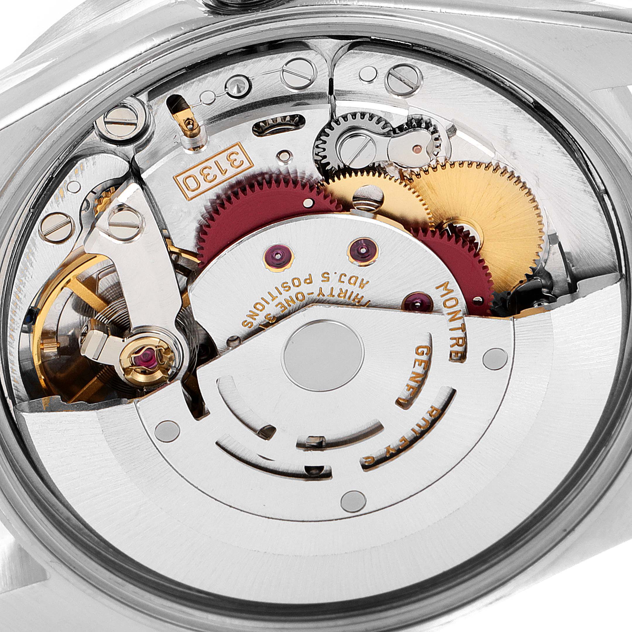 This is a close-up image of the internal mechanics of a Rolex Air-King 14010 Men's Stainless Steel Black Dial 14010 Men's Stainless Steel Black Dial watch, showcasing its intricate components and engravings.