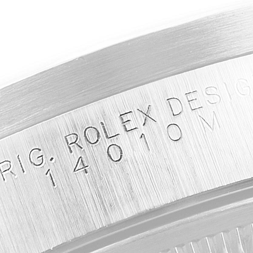 The image shows a close-up of the case with "ROLEX DESIG" engraved on the Rolex Air-King 14010 Men's Stainless Steel Black Dial 14010 Men's Stainless Steel Black Dial watch model.