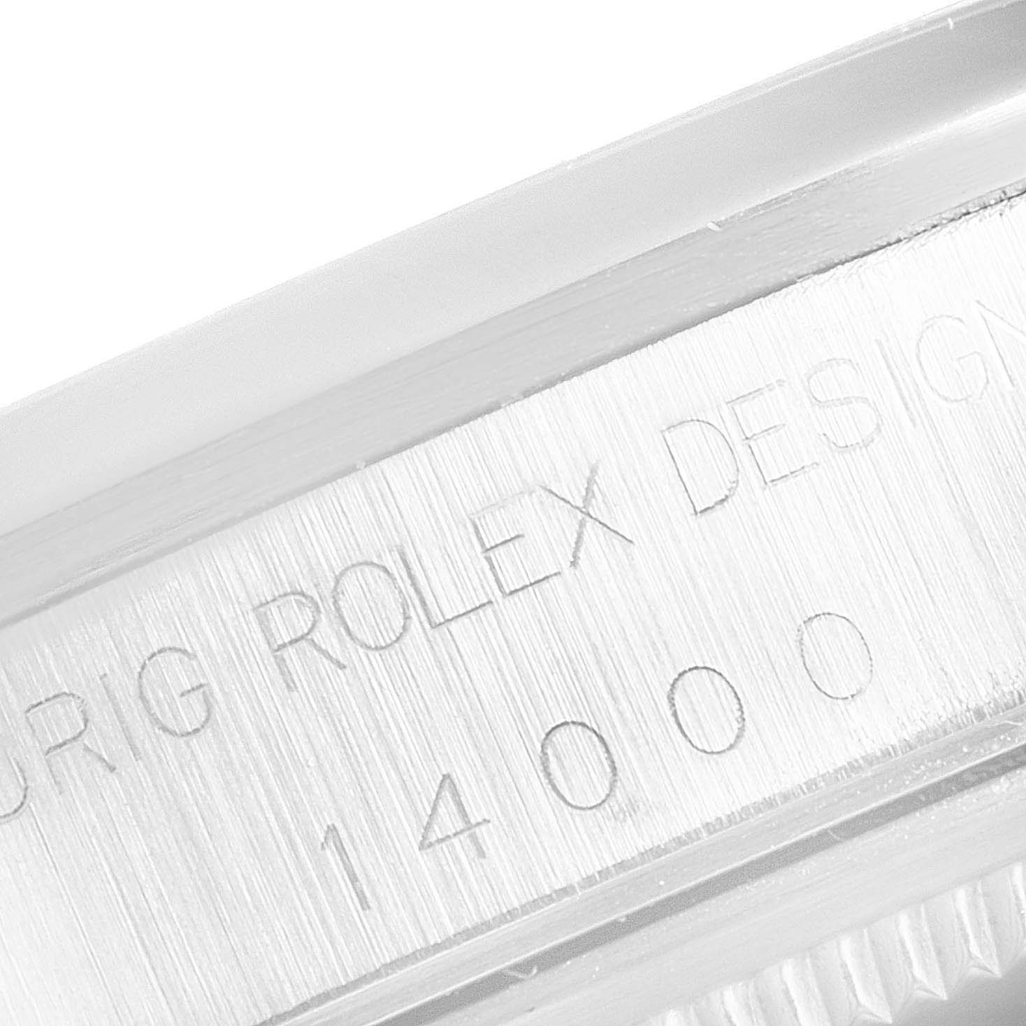 This close-up image shows the engraving on the case edge of the Rolex Air-King 14000M Men's Stainless Steel Blue Dial 14000M Men's Stainless Steel Blue Dial watch.
