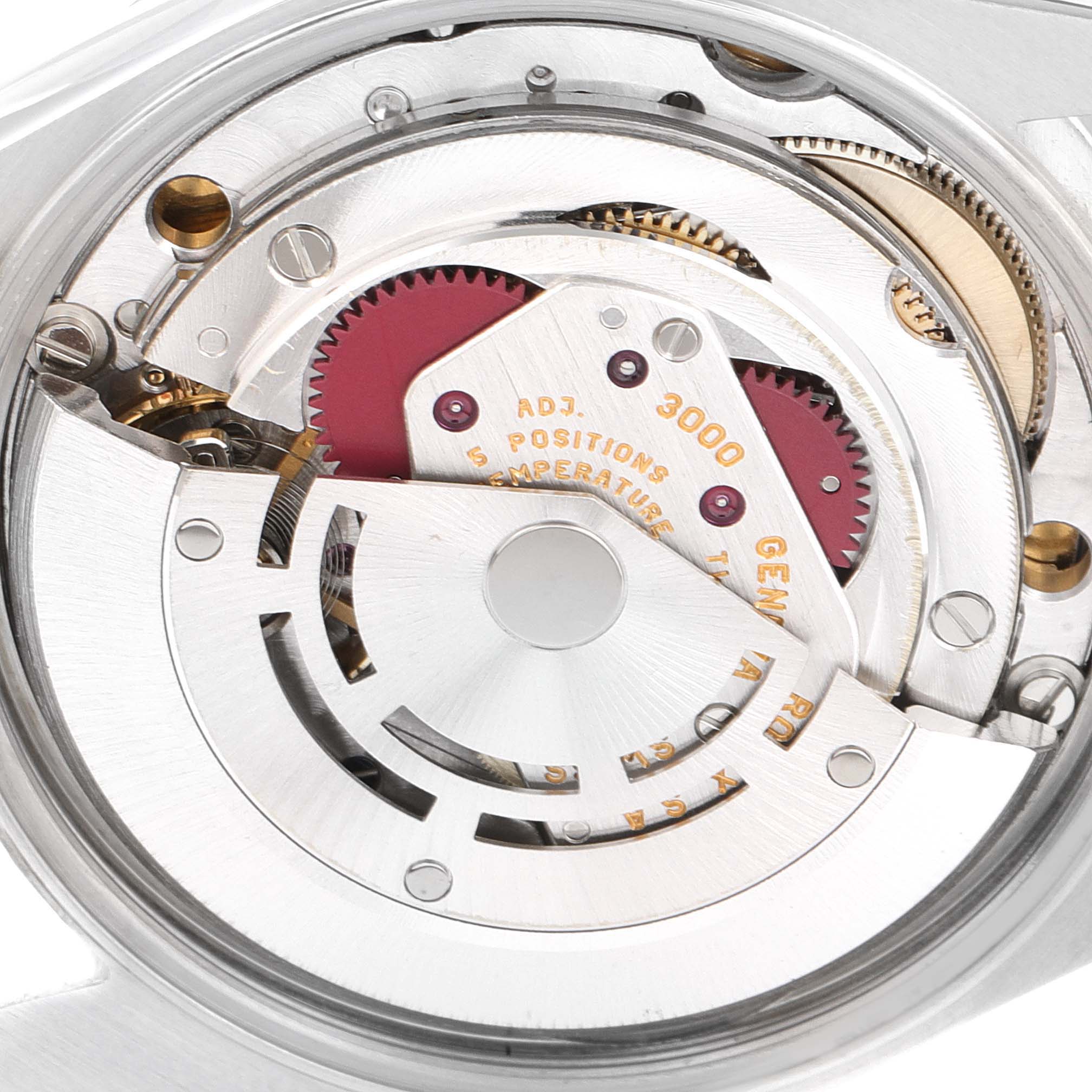 This image shows a close-up of the Rolex Air-King 14000 Men's Stainless Steel White Dial 14000 Men's Stainless Steel White Dial's mechanical movement from the back, highlighting gears and components.