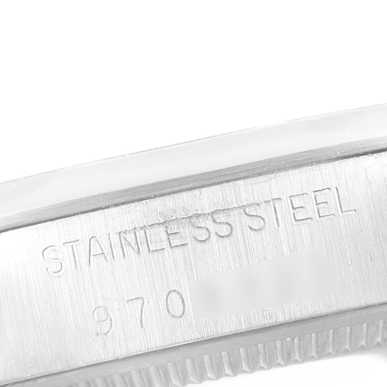 The image shows a close-up of the side of a Rolex Vintage Collection 5500 Men's Stainless Steel Silver Dial 5500 Men's Stainless Steel Silver Dial watch with "STAINLESS STEEL" inscribed on it.