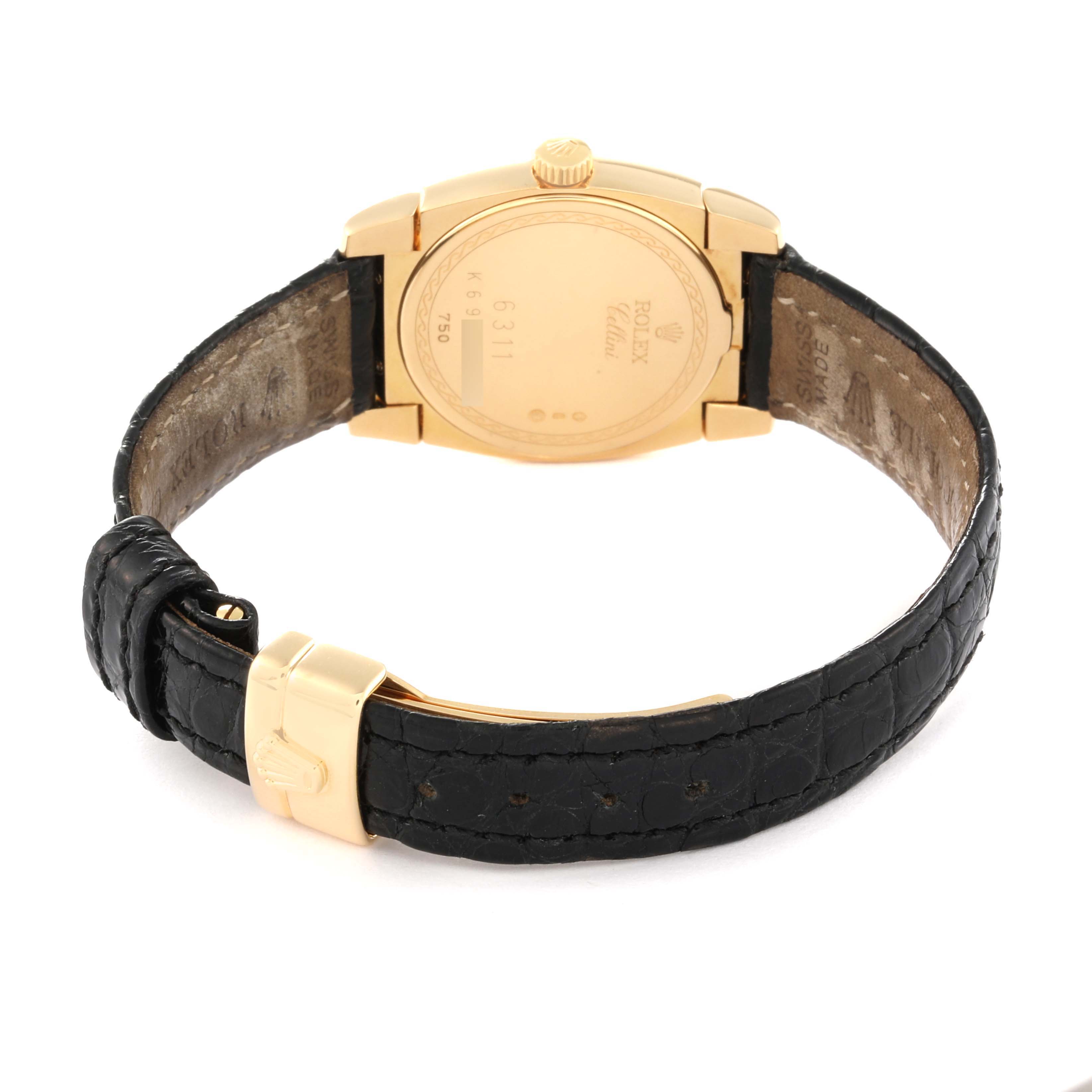 The image shows the back of a Rolex Cellini 6311 Women's Yellow Gold Mother of Pearl Dial 6311 Women's Yellow Gold Mother of Pearl Dial watch, highlighting its gold case and black leather strap with a gold buckle.