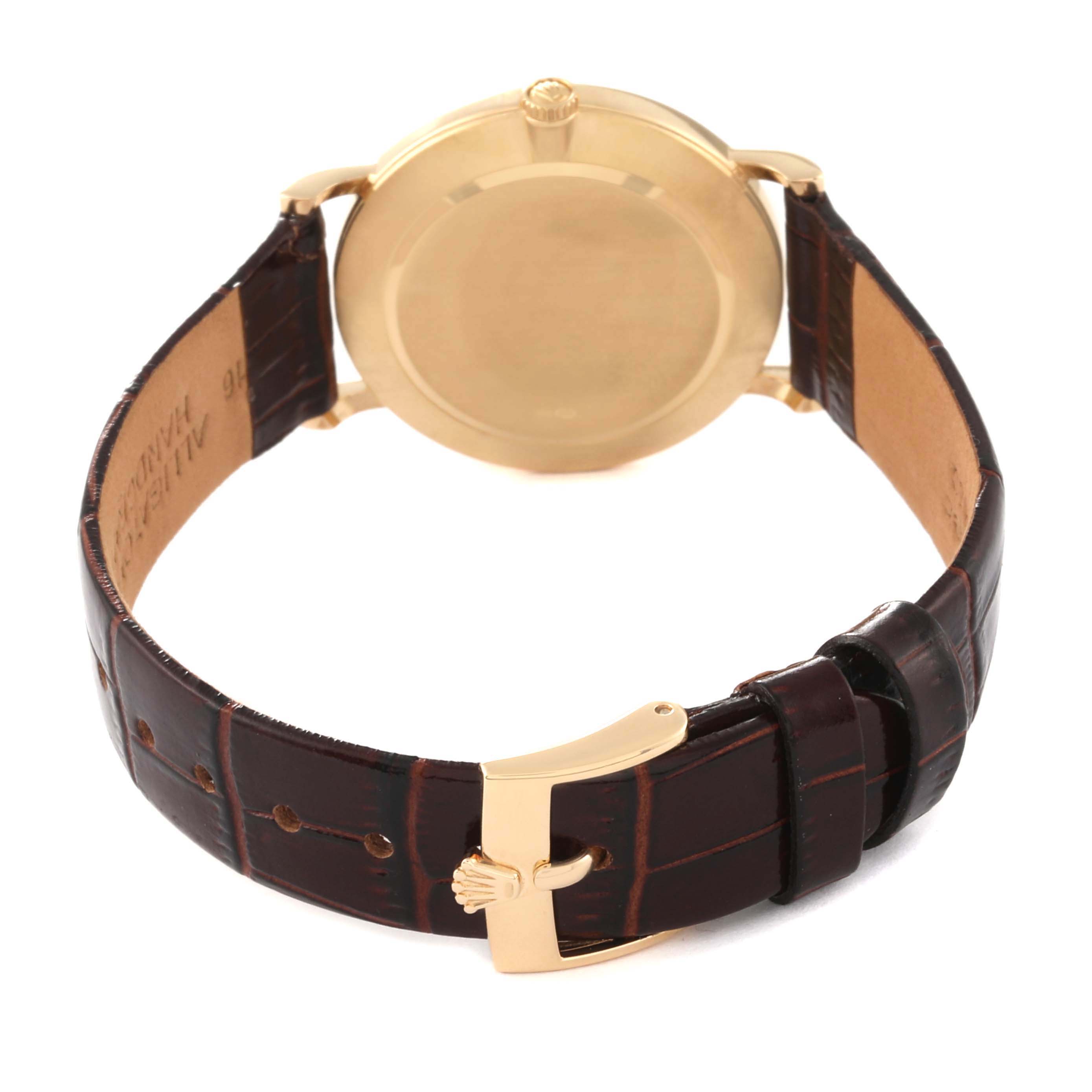 This image shows the back case, crown, and leather strap with a buckle of a Rolex Cellini 5112 Men
s Yellow Gold Champagne Dial 5112 Men
s Yellow Gold Champagne Dial watch.