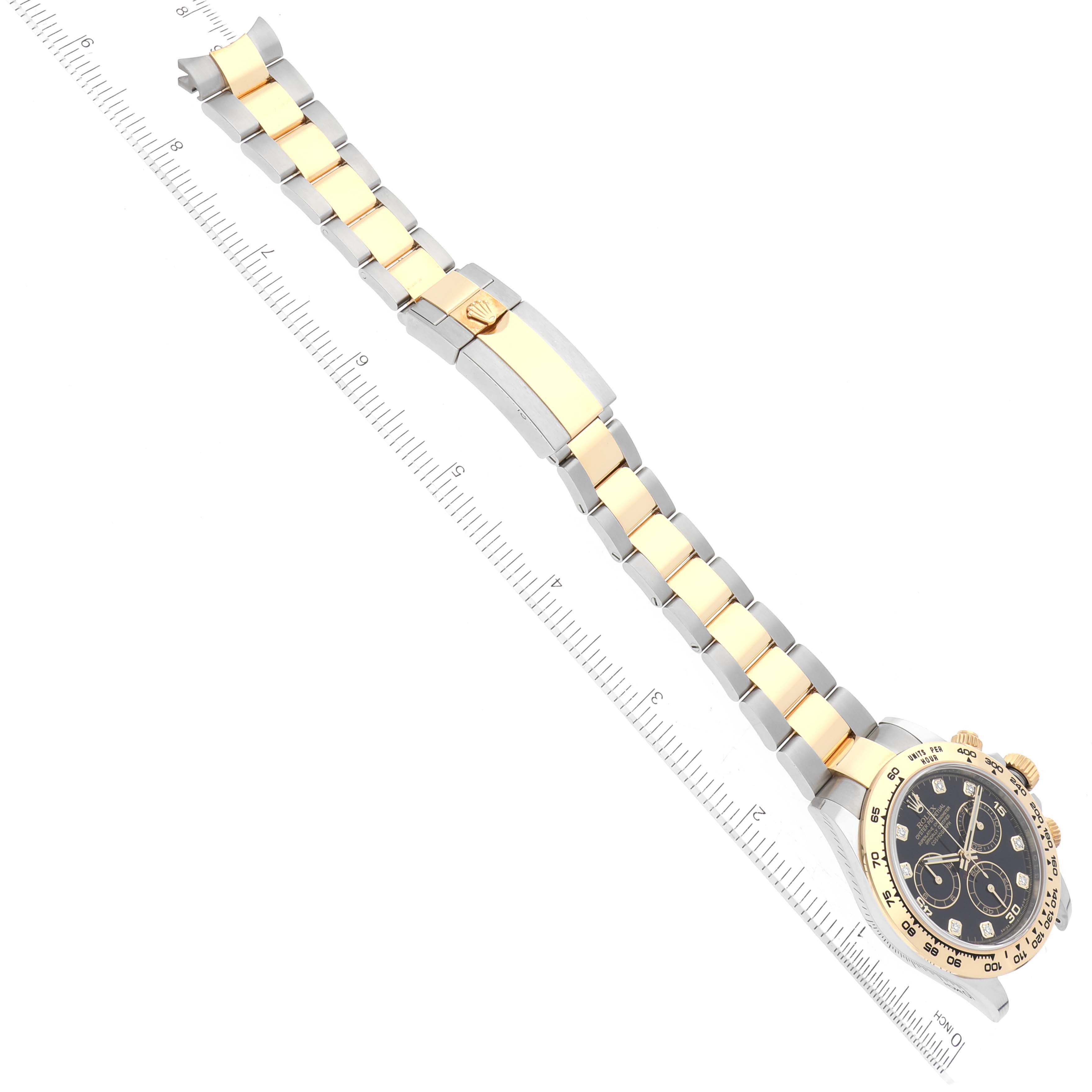 The Rolex Daytona 116503 Men
s Steel and Gold (two tone) Black Dial 116503 Men
s Steel and Gold (two tone) Black Dial watch is shown from a top-down angle, displaying the face and entire two-tone bracelet.