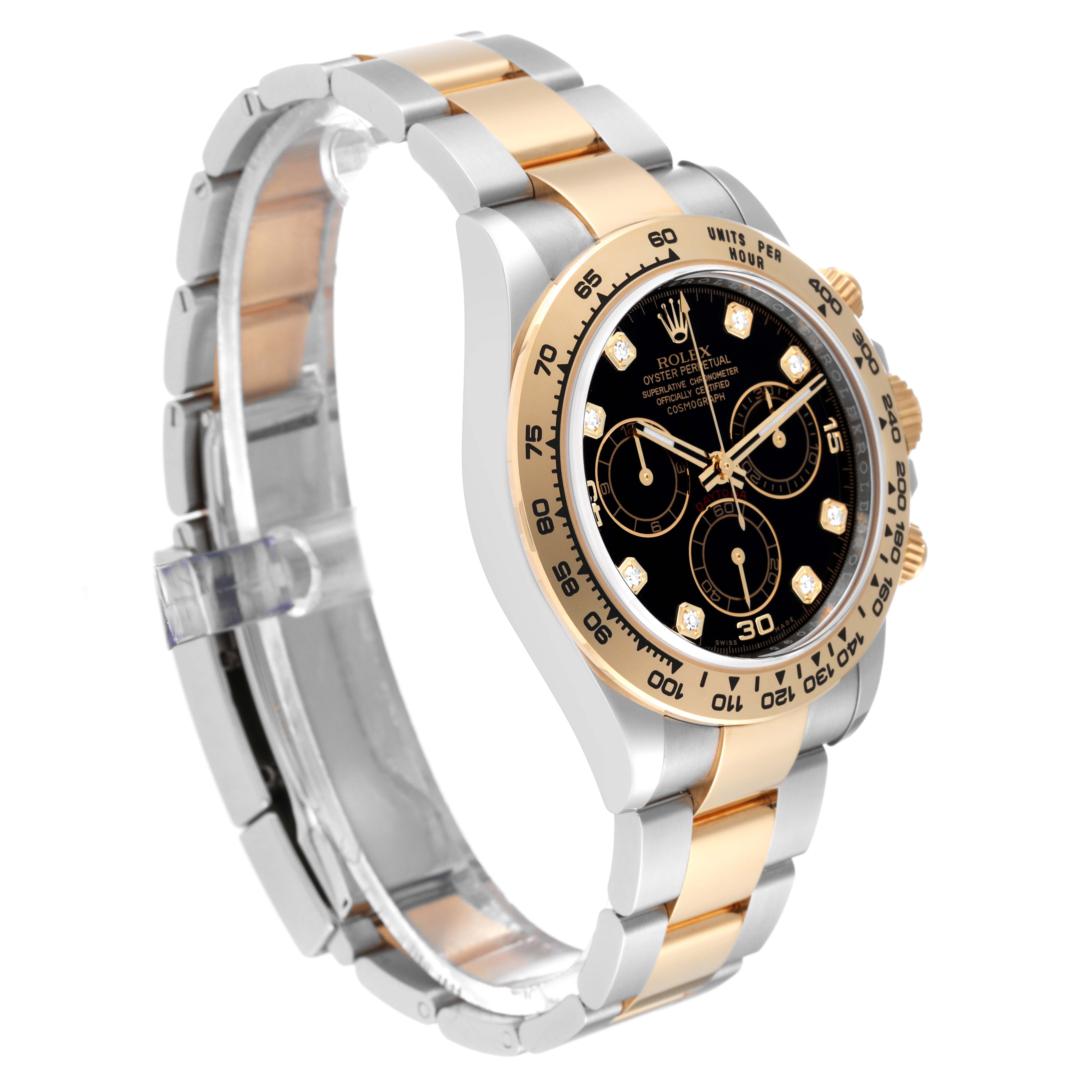 This image shows a Rolex Daytona 116503 Men
s Steel and Gold (two tone) Black Dial 116503 Men
s Steel and Gold (two tone) Black Dial watch at a three-quarter angle, highlighting its black dial, gold bezel, and two-tone bracelet.