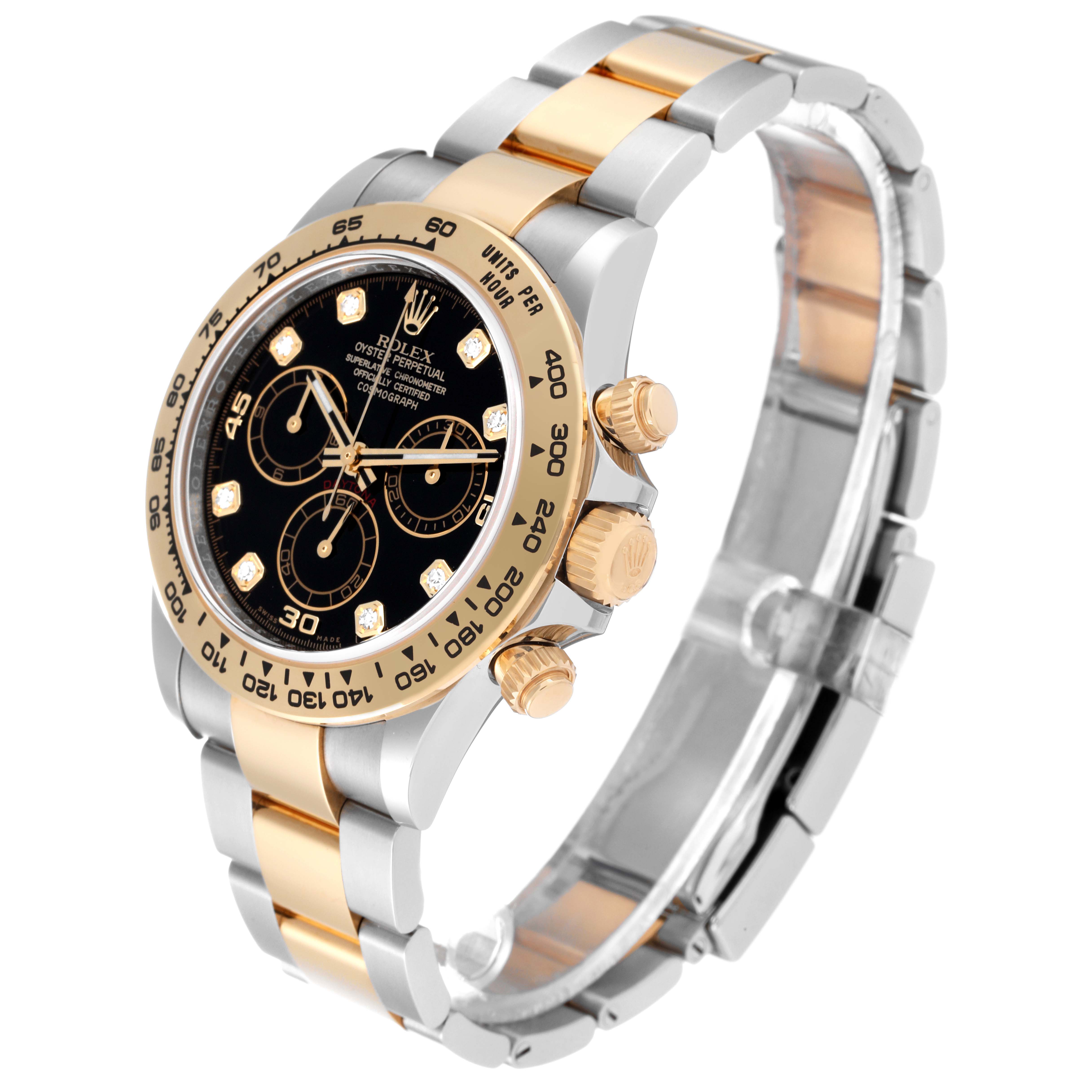 The Rolex Daytona 116503 Men
s Steel and Gold (two tone) Black Dial 116503 Men
s Steel and Gold (two tone) Black Dial watch is shown at a three-quarter angle, highlighting its black dial, gold bezel, and two-tone bracelet.