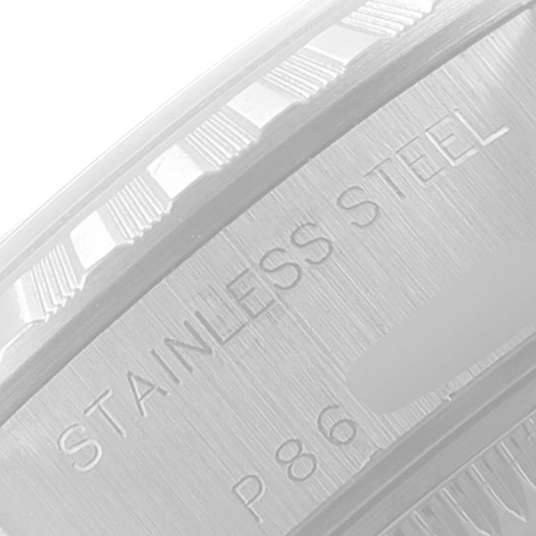 This image shows a close-up of the stainless steel casing with the textured edge of the Rolex Date 79240 Women's Stainless Steel Black Dial 79240 Women's Stainless Steel Black Dial model watch.
