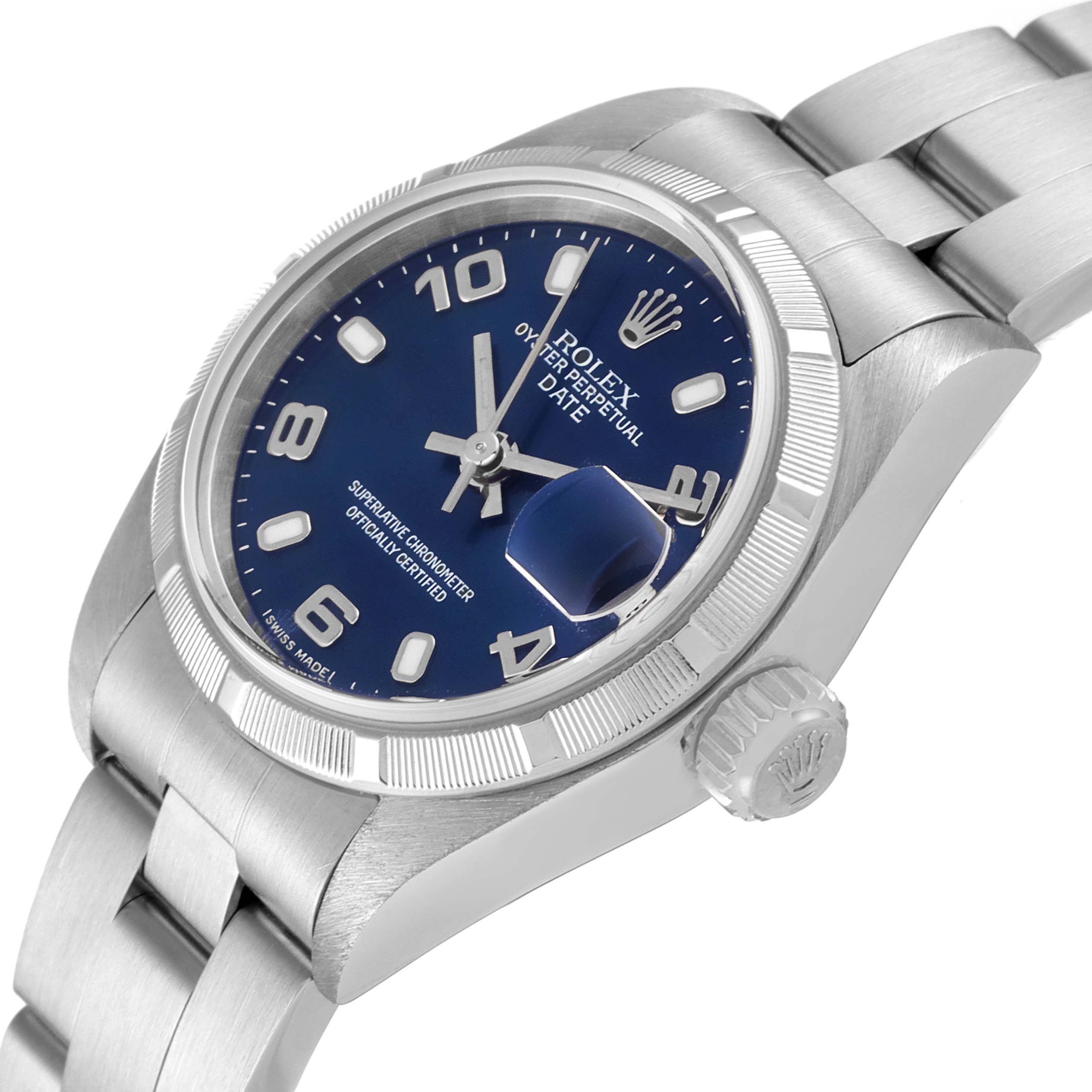 The image shows a Rolex Date 79190 Women's Stainless Steel Blue Dial 79190 Women's Stainless Steel Blue Dial model watch at a tilted angle, highlighting the face, crown, and a portion of the bracelet.