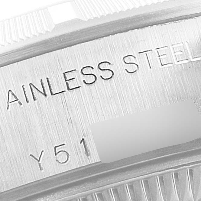 The image shows a close-up of the watch bezel and engraved details on a Rolex Date 79190 Women's Stainless Steel Blue Dial 79190 Women's Stainless Steel Blue Dial model, highlighting "STAINLESS STEEL."