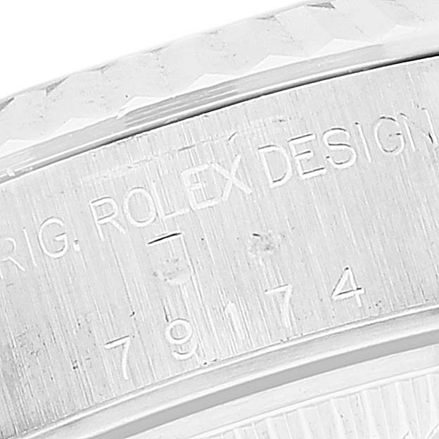 This close-up image shows the engraved model number and "Rolex Design" text on the case side of a Rolex Datejust 79174 Women's Stainless Steel Silver Dial 79174 Women's Stainless Steel Silver Dial watch.