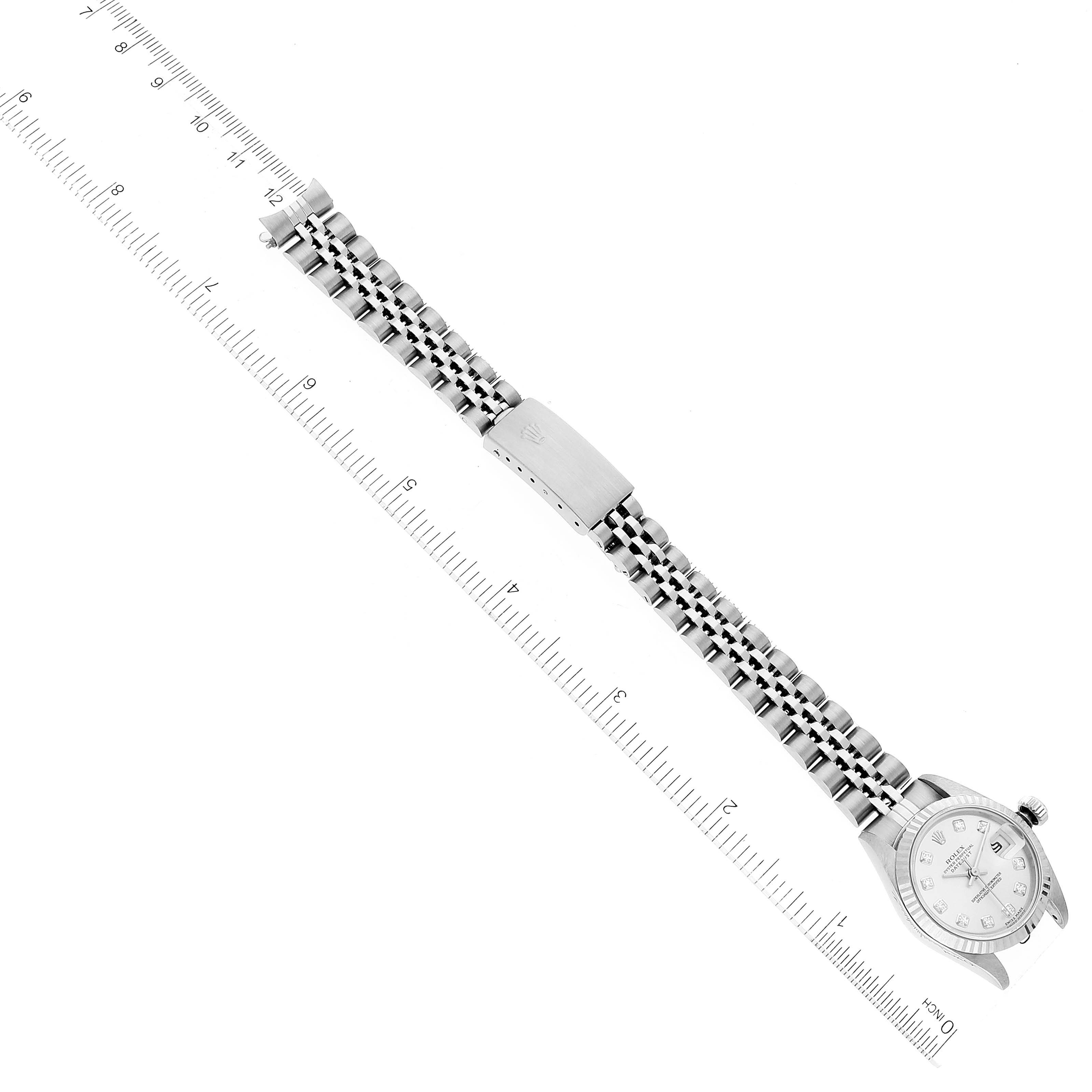 The image shows a top-down view of a Rolex Datejust 79174 Women's Stainless Steel Silver Dial 79174 Women's Stainless Steel Silver Dial watch, displaying the full bracelet and part of the watch face, alongside a ruler for scale.