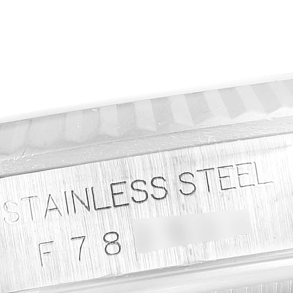 The image shows a close-up view of the case side and fluted bezel with engraved text of a Rolex Datejust 16234 Men's Stainless Steel Black Dial 16234 Men's Stainless Steel Black Dial watch.