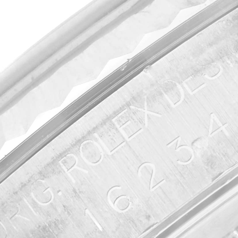 The image shows a close-up of the inner rim and engraving of a Rolex Datejust 16234 Men's Stainless Steel Blue Dial 16234 Men's Stainless Steel Blue Dial model watch.