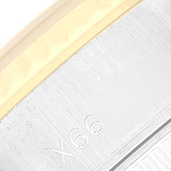 This image shows a close-up view of the side case of a Rolex Datejust 69173 Women's Steel and Gold (two tone) Blue Dial 69173 Women's Steel and Gold (two tone) Blue Dial watch, highlighting the serial number engraving.