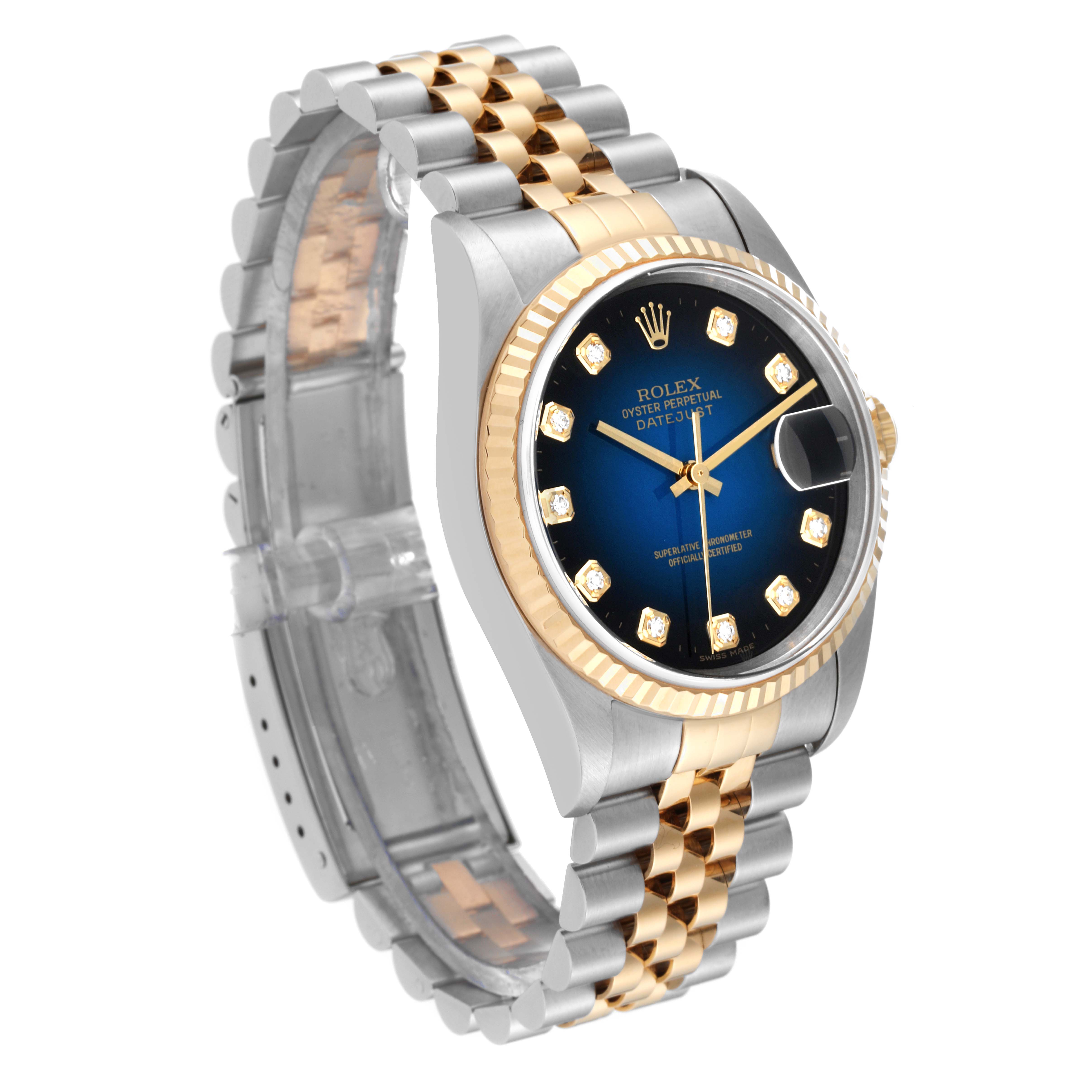This image shows a Rolex Datejust 16233 Men's Steel and Gold (two tone) Blue Dial 16233 Men's Steel and Gold (two tone) Blue Dial watch angled to display its face, bezel, and two-tone bracelet.