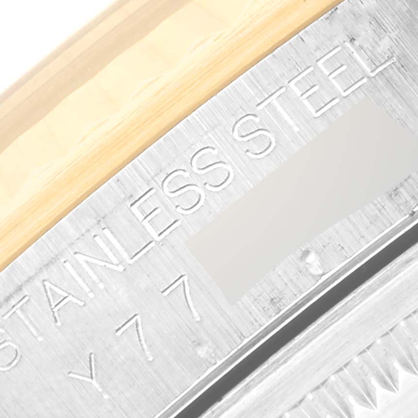 The image shows a close-up of the case side and part of the bezel, highlighting the "STAINLESS STEEL" engraving on the Rolex Datejust 16233 Men's Steel and Gold (two tone) Blue Dial 16233 Men's Steel and Gold (two tone) Blue Dial.