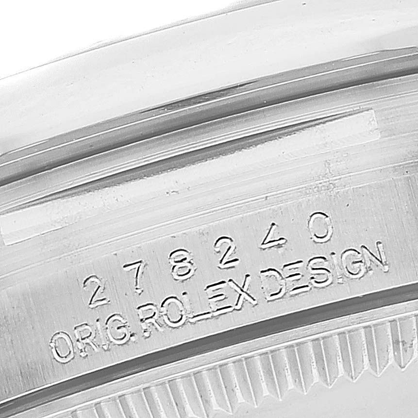 This image shows a close-up of the serial number engraving on a Rolex Mid-Size 278240 Women's Stainless Steel Green Dial 278240 Women's Stainless Steel Green Dial model watch case.