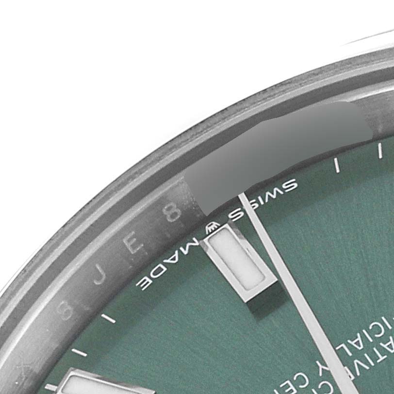 This image shows a close-up of the dial and edge of a Rolex Mid-Size 278240 Women's Stainless Steel Green Dial 278240 Women's Stainless Steel Green Dial watch, highlighting the "SWISS MADE" marking.