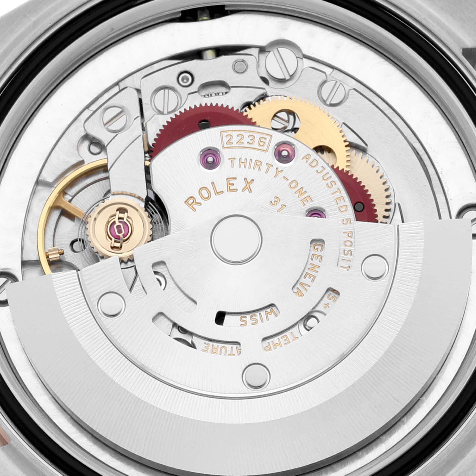 The image shows a close-up of the movement mechanism of a Rolex Mid-Size 278241 Women's Steel and Gold (two tone) Purple Dial 278241 Women's Steel and Gold (two tone) Purple Dial model watch.