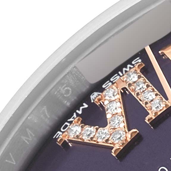 This close-up image of a Rolex Mid-Size 278241 Women's Steel and Gold (two tone) Purple Dial 278241 Women's Steel and Gold (two tone) Purple Dial model watch shows a portion of the bezel, dial, and a diamond-encrusted Roman numeral.