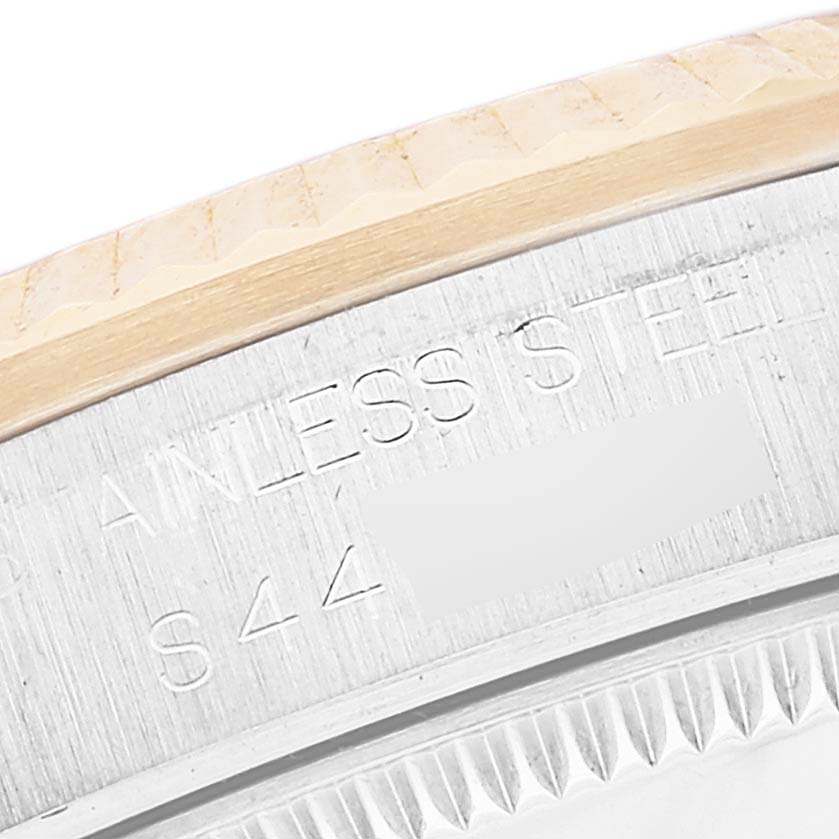 This close-up shows the engraved stainless steel bezel of a Rolex Mid-Size 68273 Women
s Steel and Gold (two tone) Champagne Dial 68273 Women
s Steel and Gold (two tone) Champagne Dial model watch.