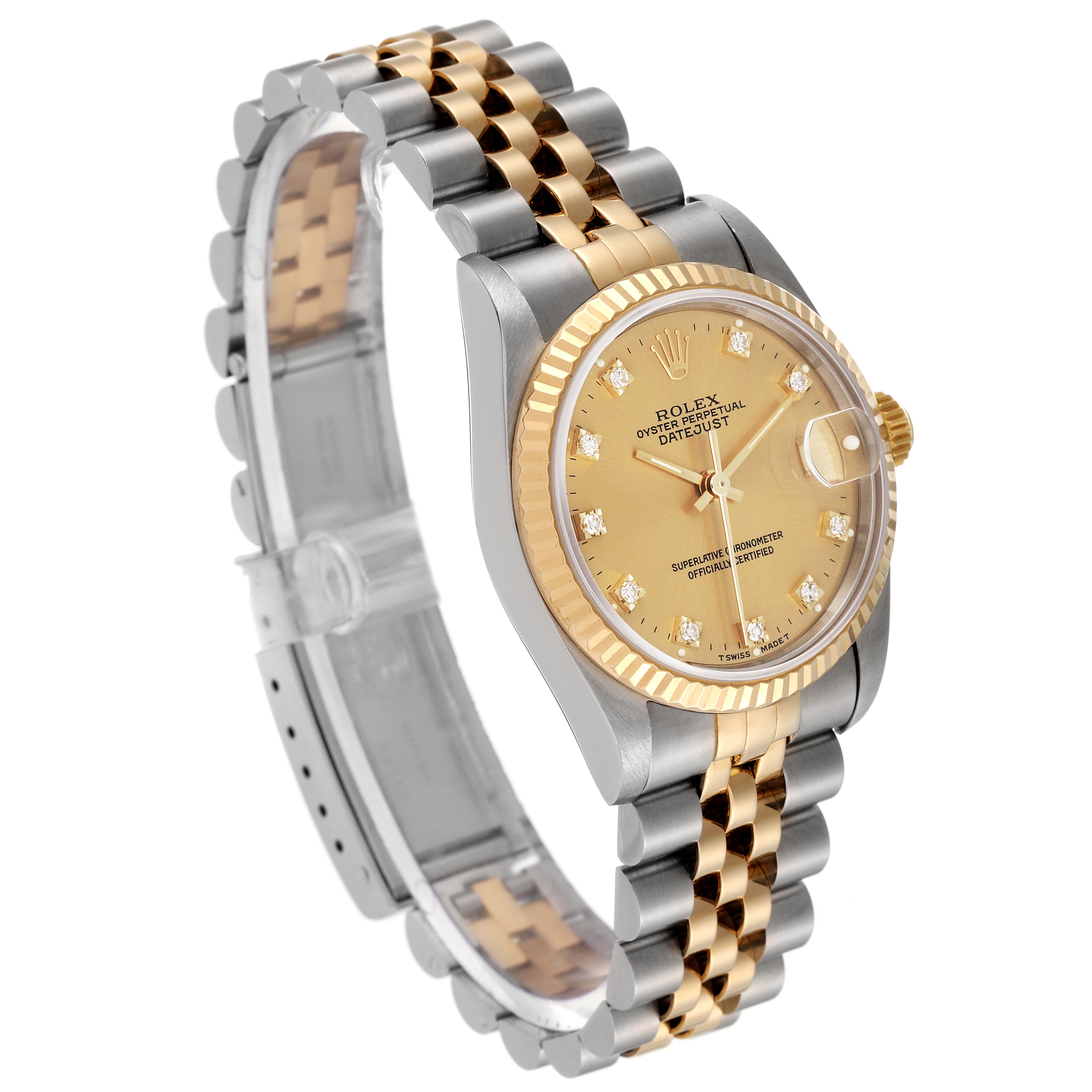 This image showcases a sideways angle of a Rolex Mid-Size 68273 Women
s Steel and Gold (two tone) Champagne Dial 68273 Women
s Steel and Gold (two tone) Champagne Dial Datejust watch, highlighting the jubilee bracelet, fluted bezel, and diamond-accented dial.