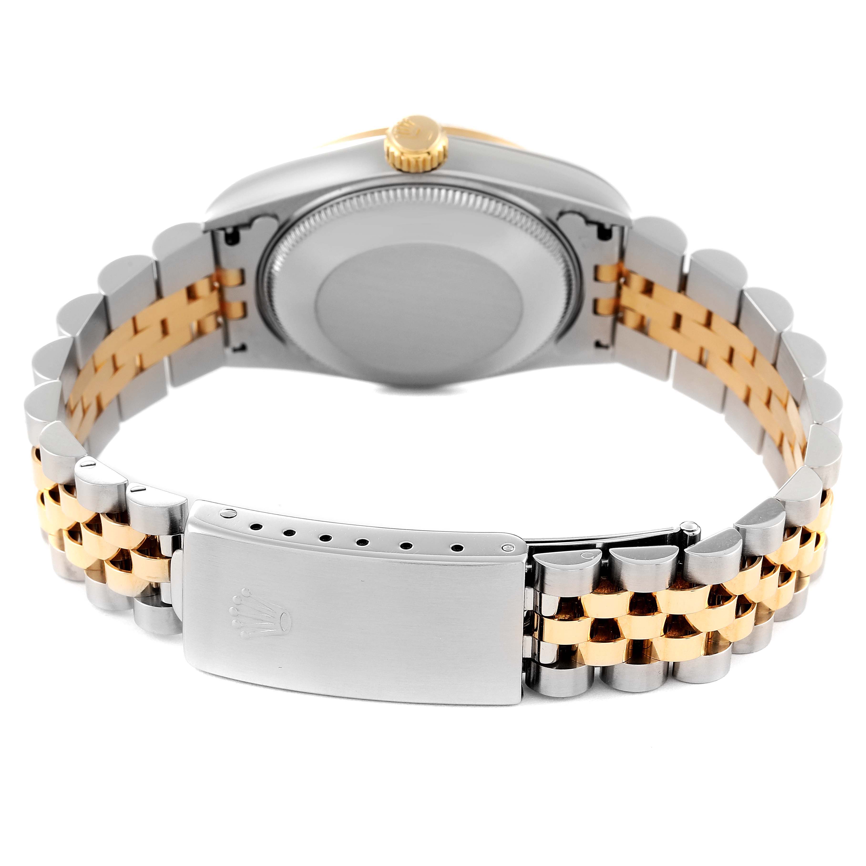 The image shows the back view of a Rolex Mid-Size 68273 Women
s Steel and Gold (two tone) Champagne Dial 68273 Women
s Steel and Gold (two tone) Champagne Dial watch, highlighting its two-tone bracelet and clasp.