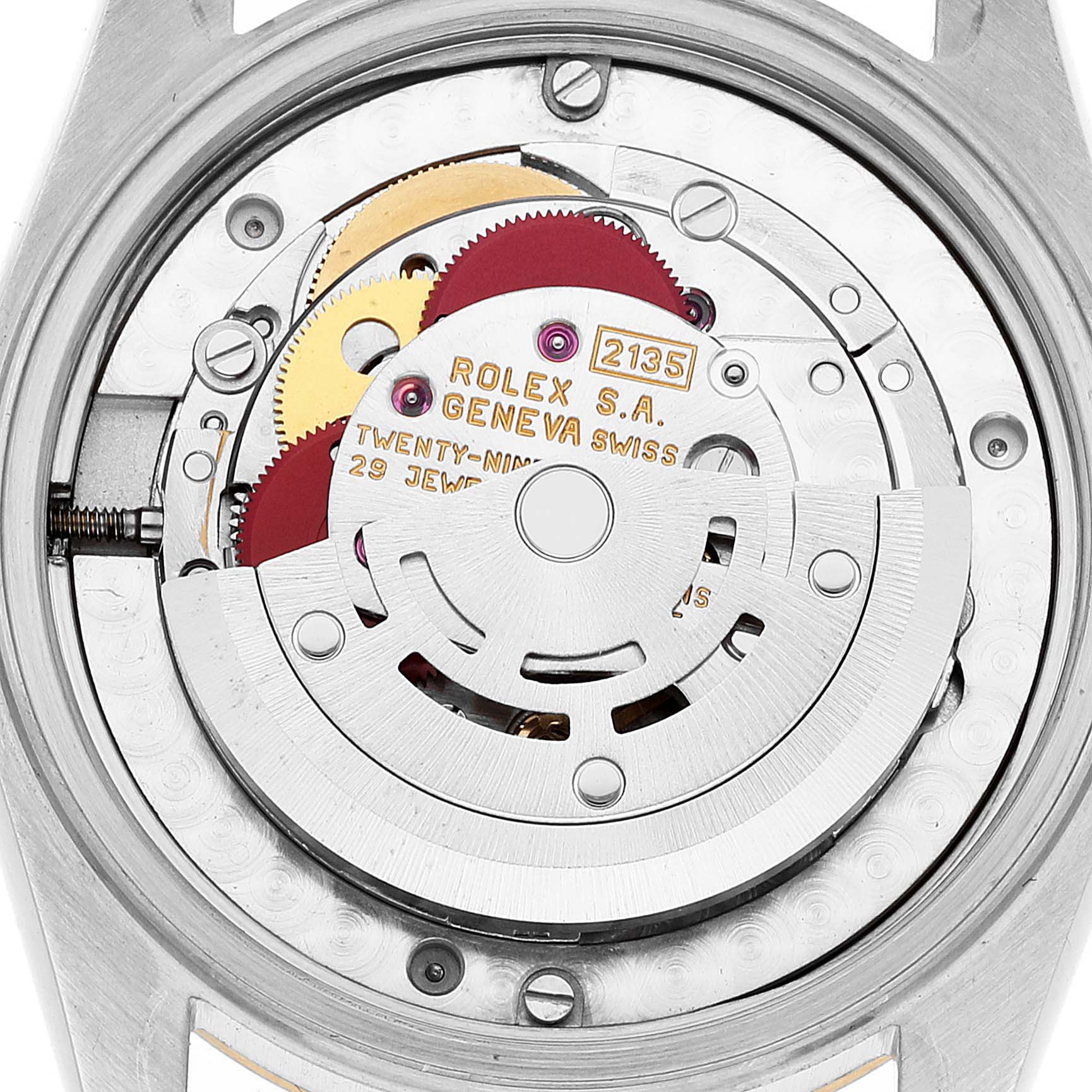 This image shows the movement mechanism of the mid-size Rolex watch, including gears and the rotor, from a rear angle.