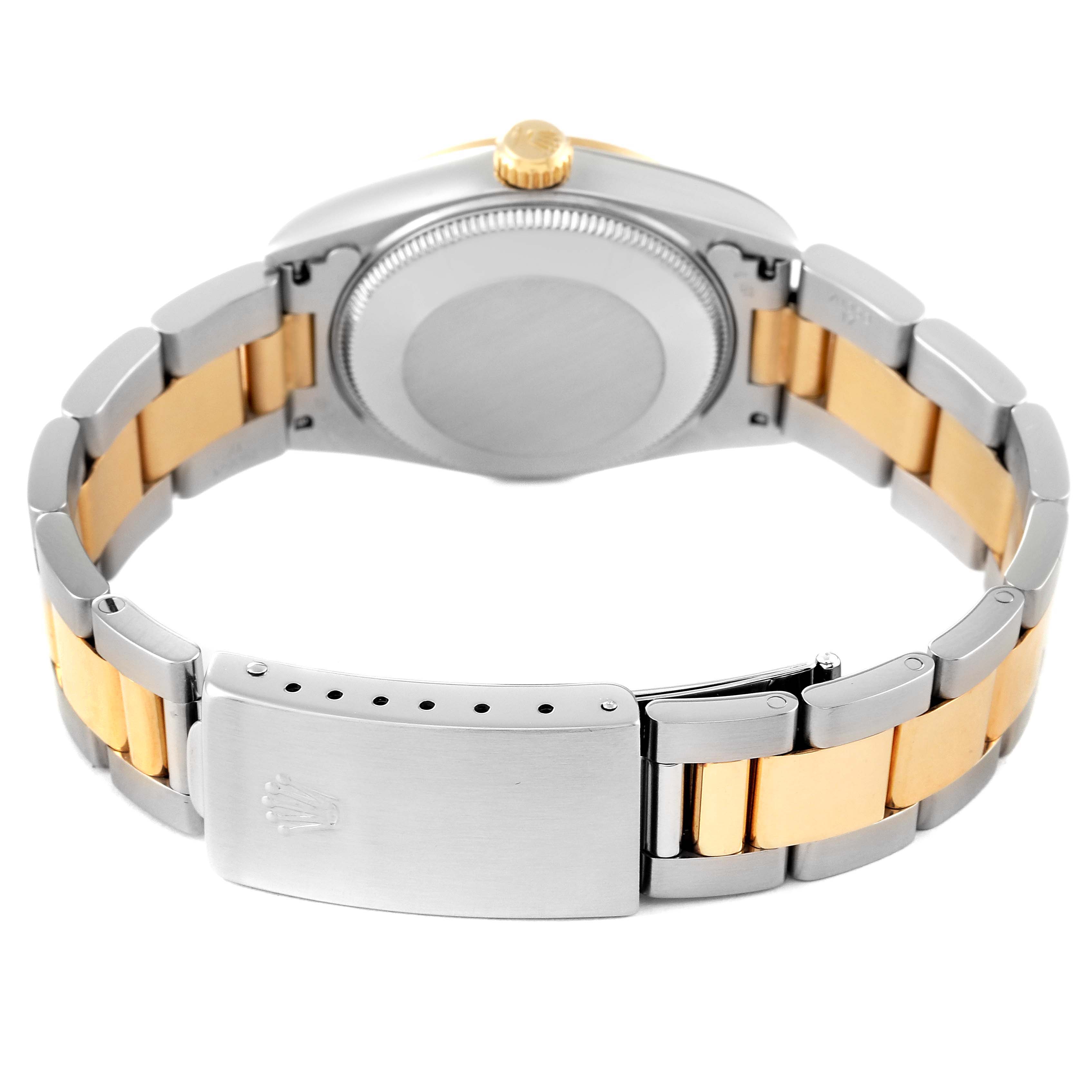 The image shows the back and clasp of a mid-size Rolex watch, highlighting the two-tone metal bracelet and the caseback.