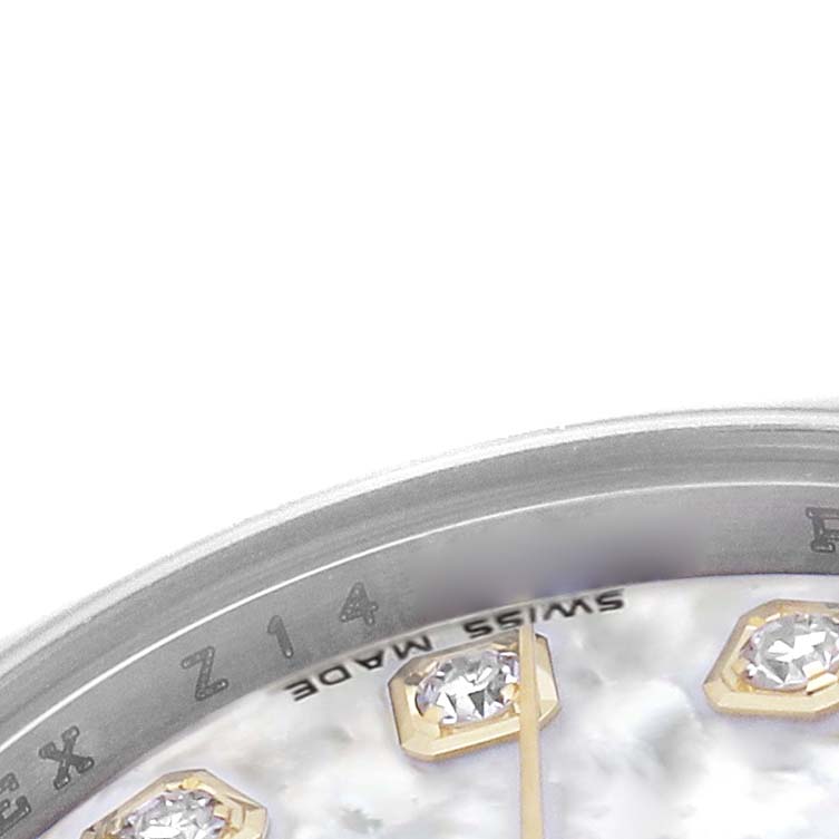 The image shows a close-up of the Rolex Datejust 179173 Women's Steel and Gold (two tone) Mother of Pearl Dial's dial with diamond markers and part of the bezel.