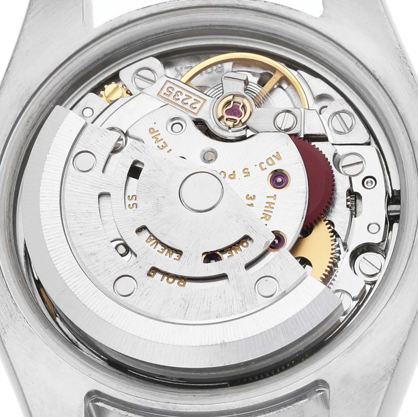 The image shows a close-up of the movement inside a Rolex Datejust 179173 Women's Steel and Gold (two tone) Mother of Pearl Dial watch, highlighting the rotor and gears.