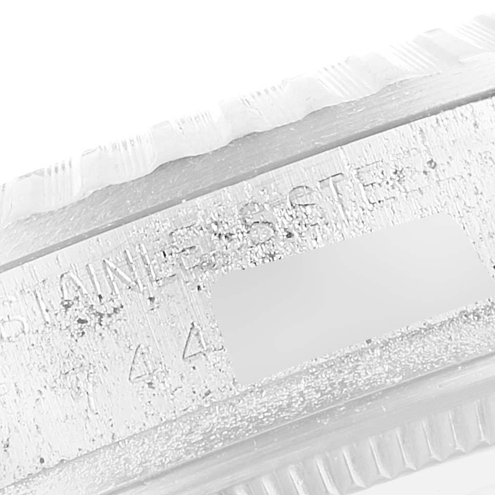 This close-up image shows the edge and engraved details of the bezel of a Rolex Vintage Collection 16030 Men's Stainless Steel Silver Dial 16030 Men's Stainless Steel Silver Dial watch.