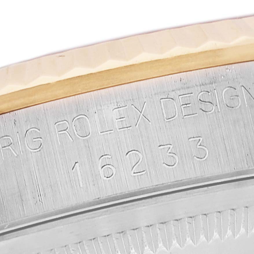 This image shows a close-up of the engraved model number "16233" on the inner rim of a Rolex Datejust 16233 Men's Steel and Gold (two tone) Champagne Dial 16233 Men's Steel and Gold (two tone) Champagne Dial watch.