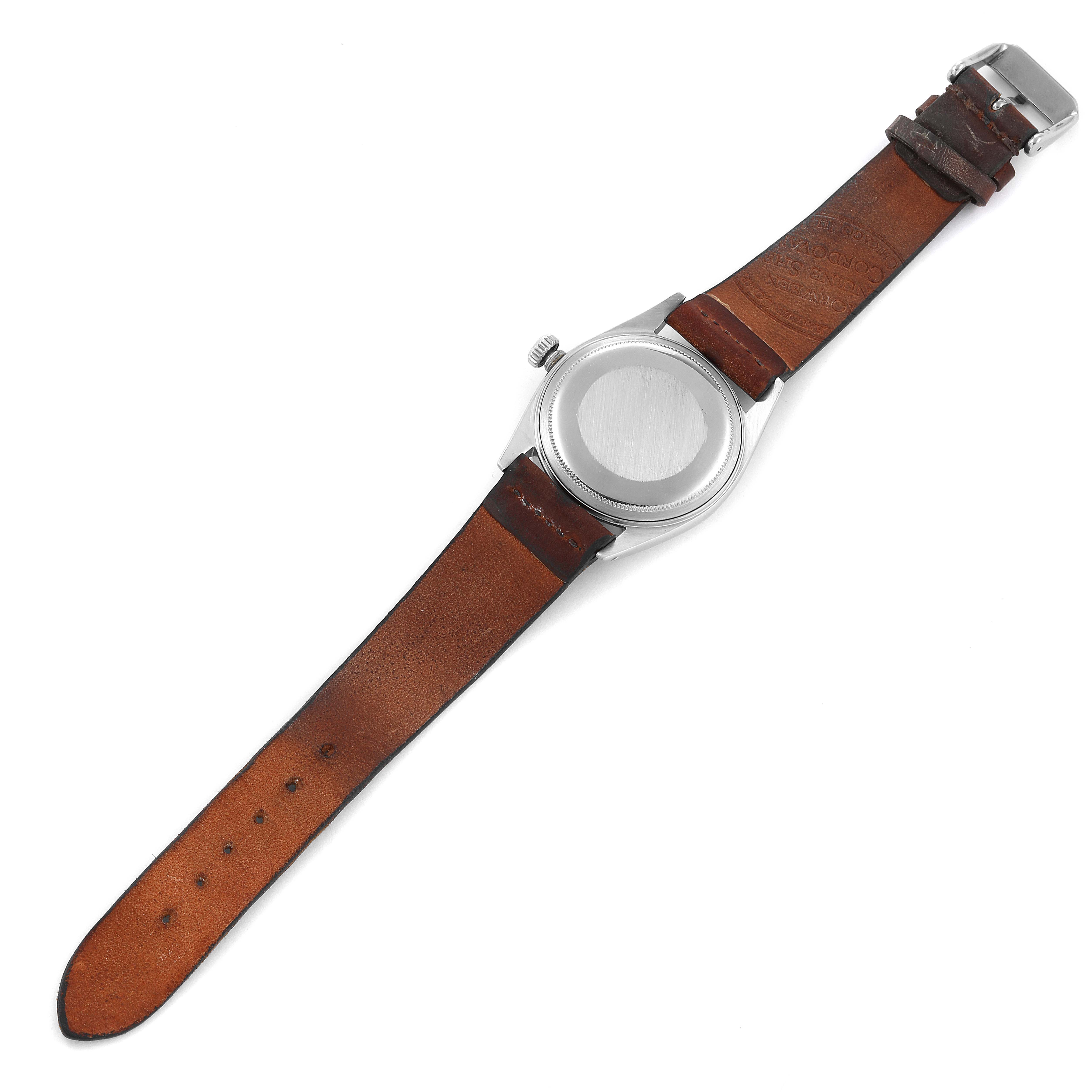 The image shows the back view of a Vintage Collection Rolex watch, highlighting its leather strap and case back.